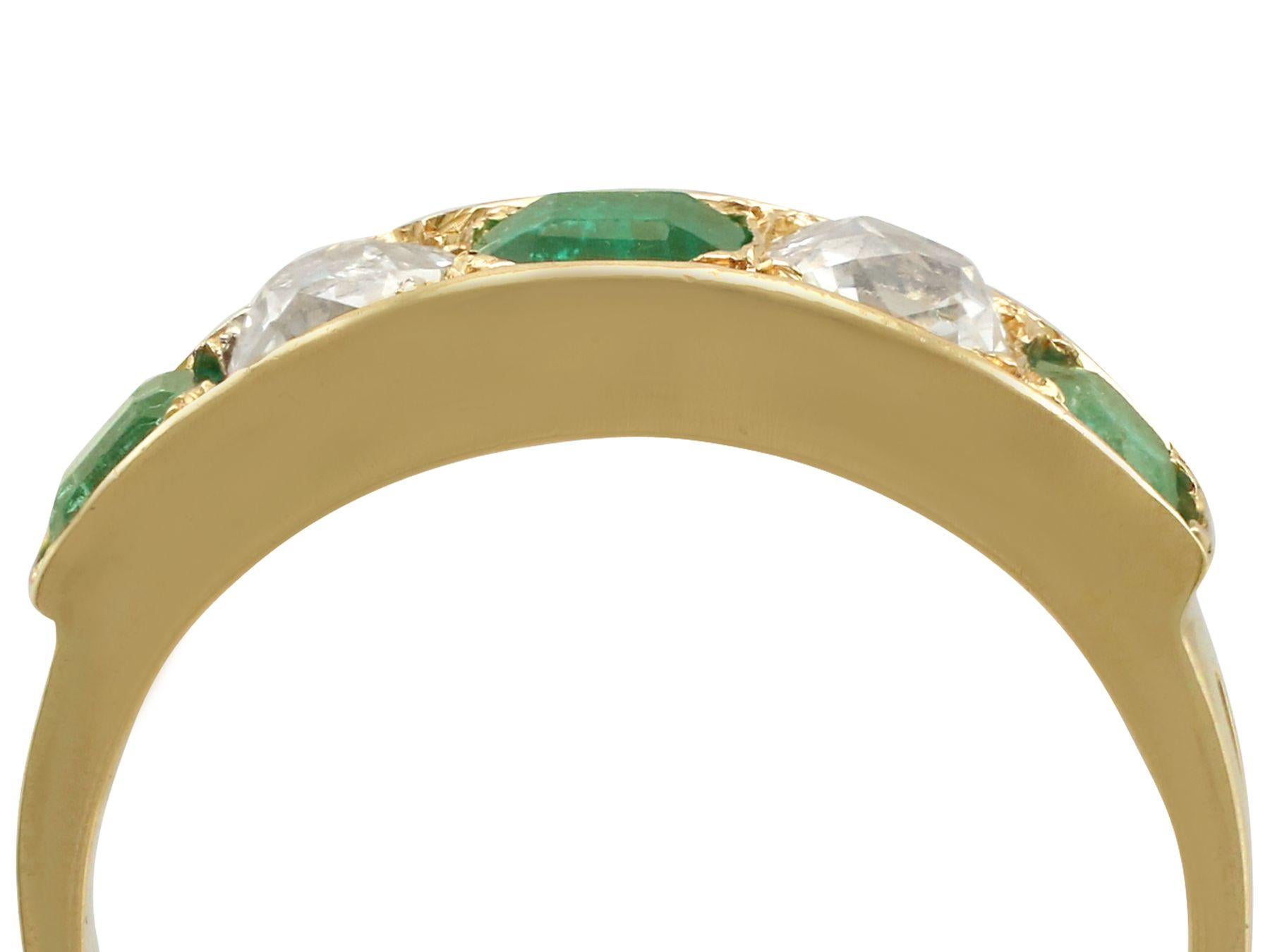 An impressive antique 0.80 carat emerald and 0.62 carat diamond, 18 karat yellow gold five stone cocktail ring; part of our diverse antique jewelry collections.

This fine and impressive diamond and emerald ring has been crafted in 18k yellow