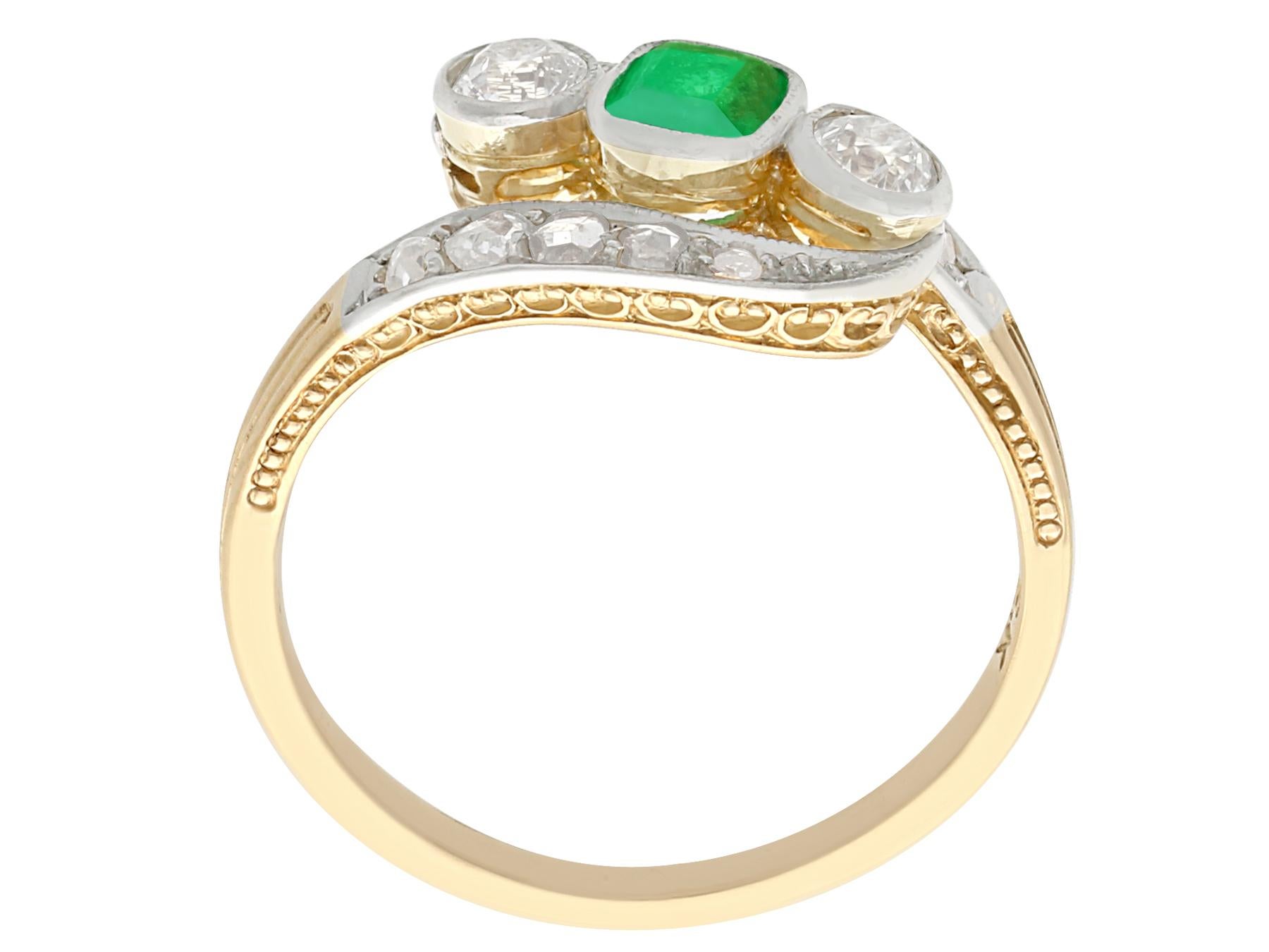 Emerald Cut Antique 1920s Emerald and Diamond Yellow Gold Twist Ring