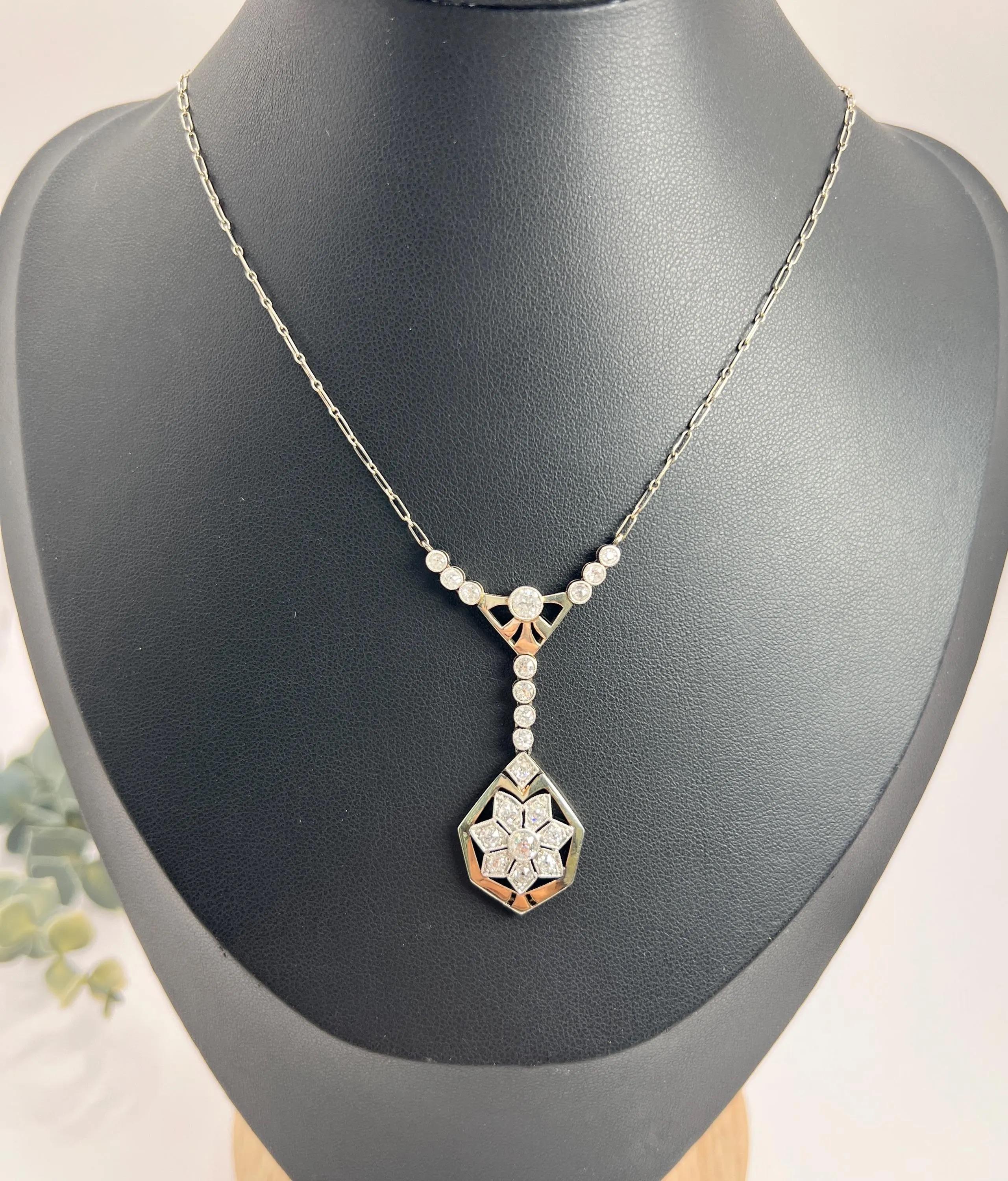 Antique Diamond Necklace 

Platinum French Stamped

Circa 1920s

Step back in time with this exquisite 1920s platinum necklace, a true testament to the elegance of the Art Deco era. The necklace features a stunning Y-shaped pendant, artfully