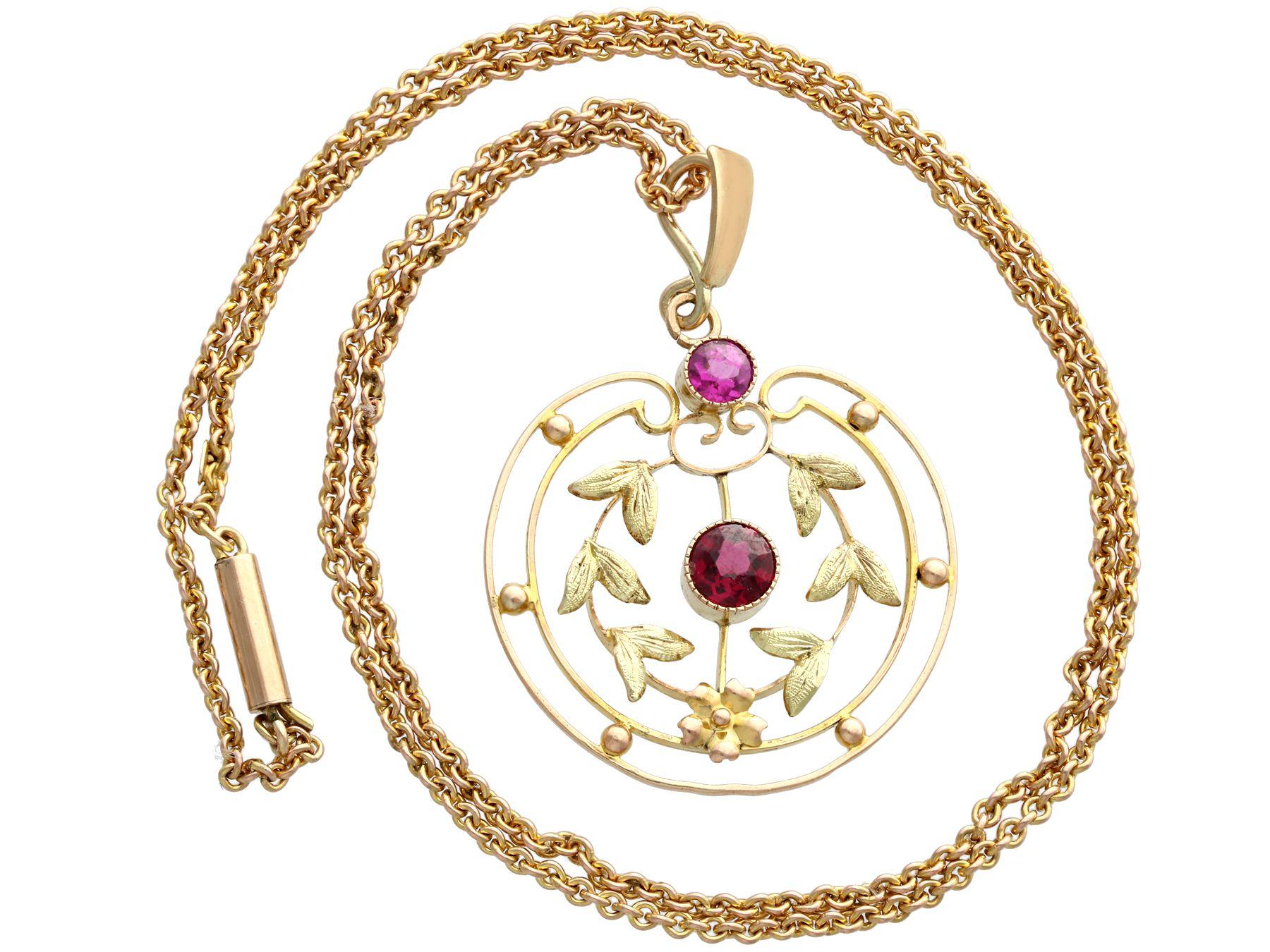 An impressive antique 0.48 carat amethyst and garnet, 9 karat yellow gold pendant; part of our diverse gemstone jewelry collections.

This fine and impressive amethyst and garnet pendant has been crafted in 9k yellow gold.

The pierced decorated,