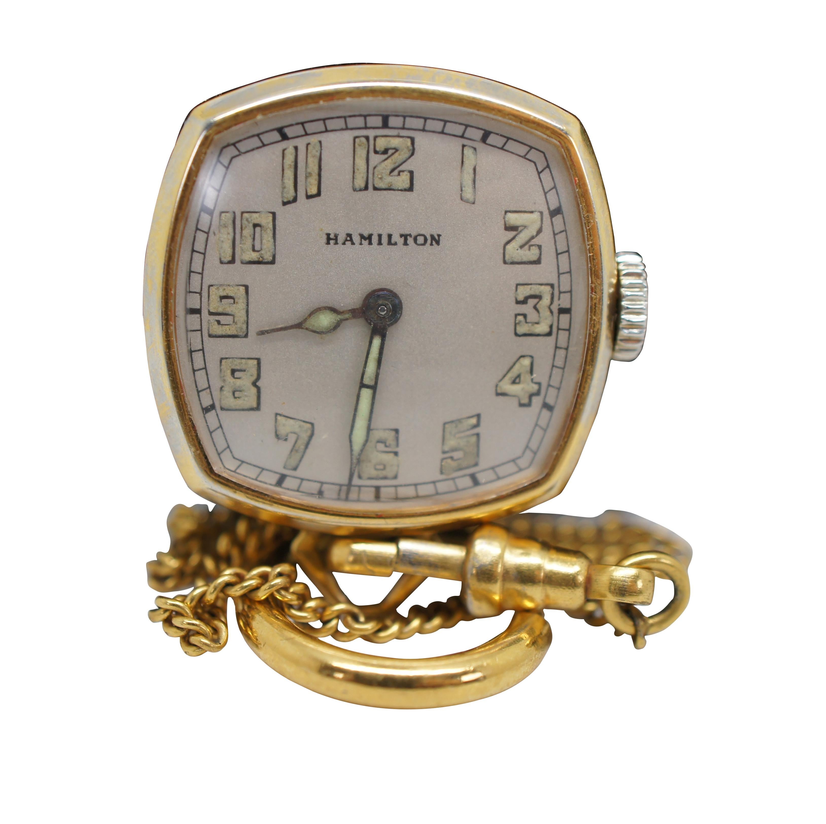 Antique 1920’s Hamilton Watch Company square pocket watch.  Features 986A, 17 Jewel works, numbered 2187511 and an H 6/0 Wadsworth quality 14K solid gold case and chain numbered 0111731. The hands and Arabic numerals on the face are finished with