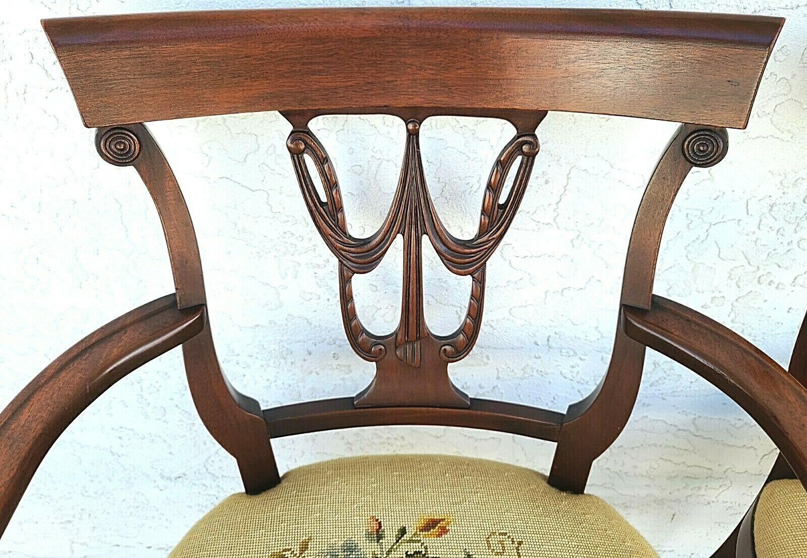 Set of 6 antique 1920s Italian Regency mahogany dining chairs with needlepoint seats
The needlepoint was done by the original owner and each seat has a different pattern.
Set includes 2 arm and 4 side chairs

Approximate Measurements in