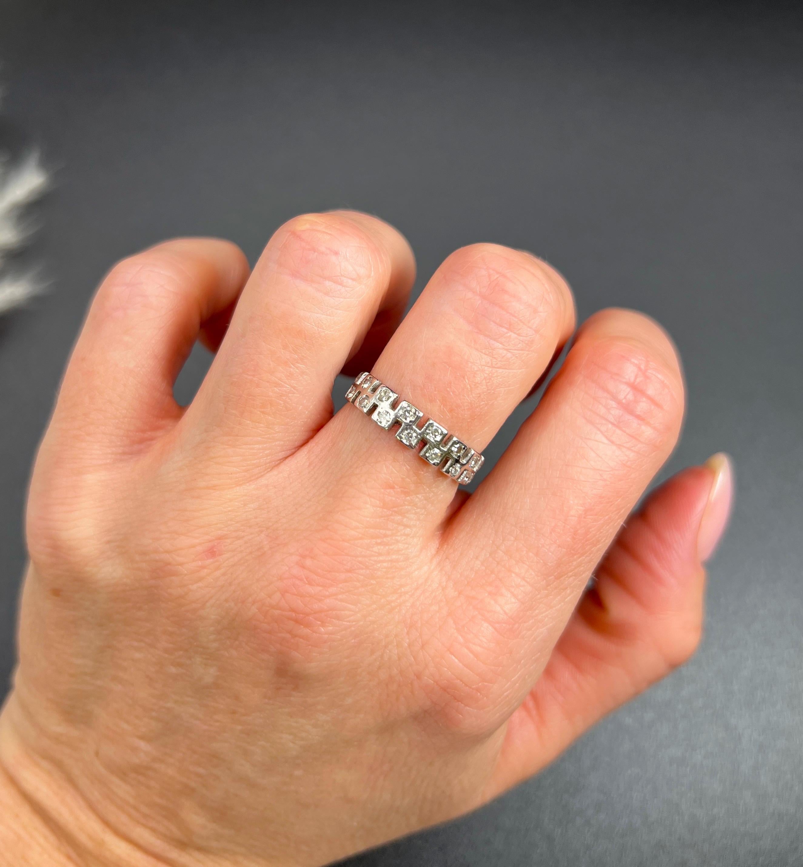 Antique Eternity Ring 

Platinum Tested

Circa 1920s

Step back in time with this exquisite 1920s platinum eternity ring, a true embodiment of vintage elegance. This stunning piece features an intricate design with natural diamonds set in a