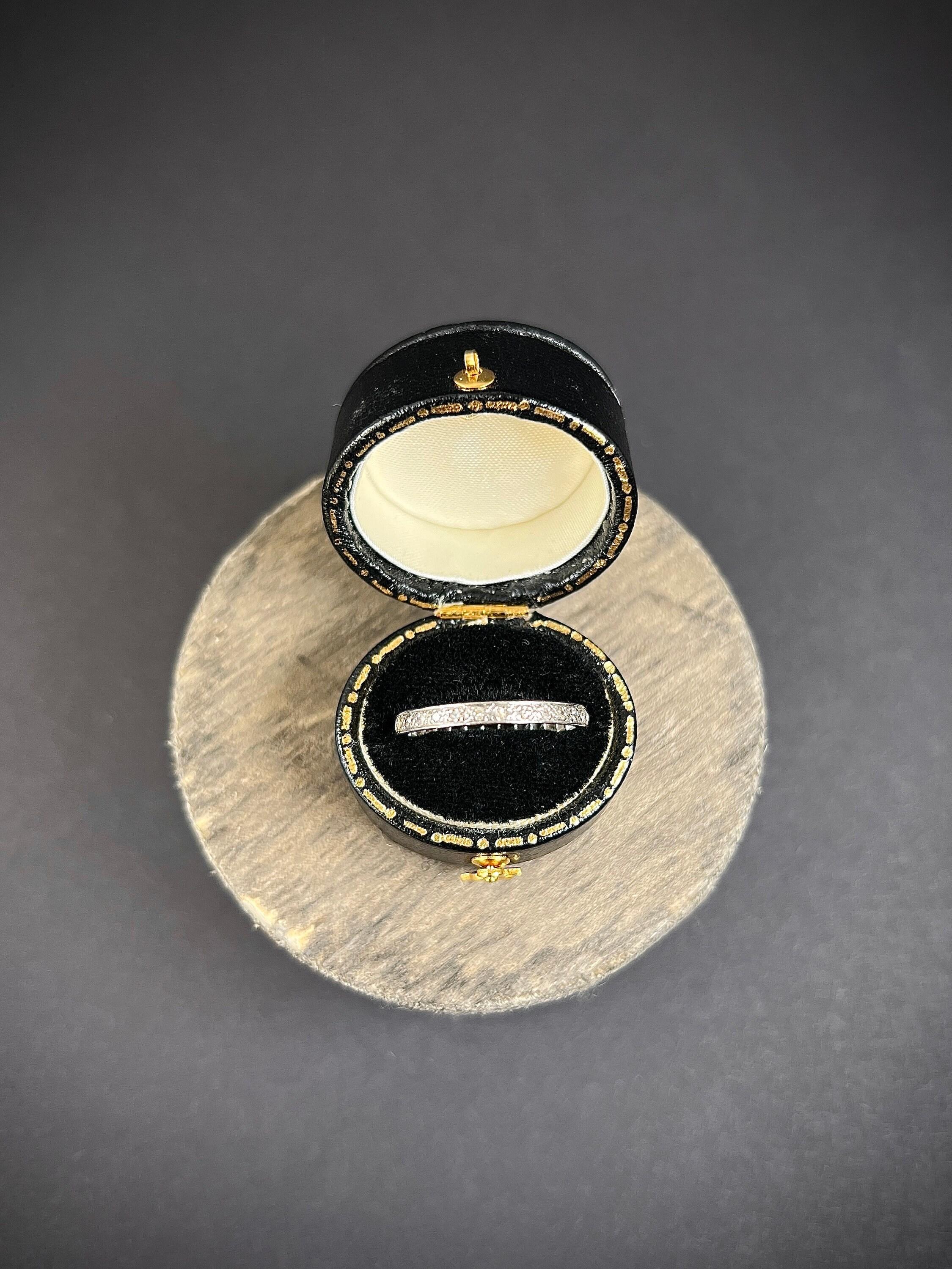 Antique Eternity Ring 

Platinum Tested

Circa 1920s

This exquisite platinum eternity ring is an absolute beauty. It is fully set with fabulous rose-cut diamonds that sparkle and shine brilliantly. The ring is designed to symbolise endless love and