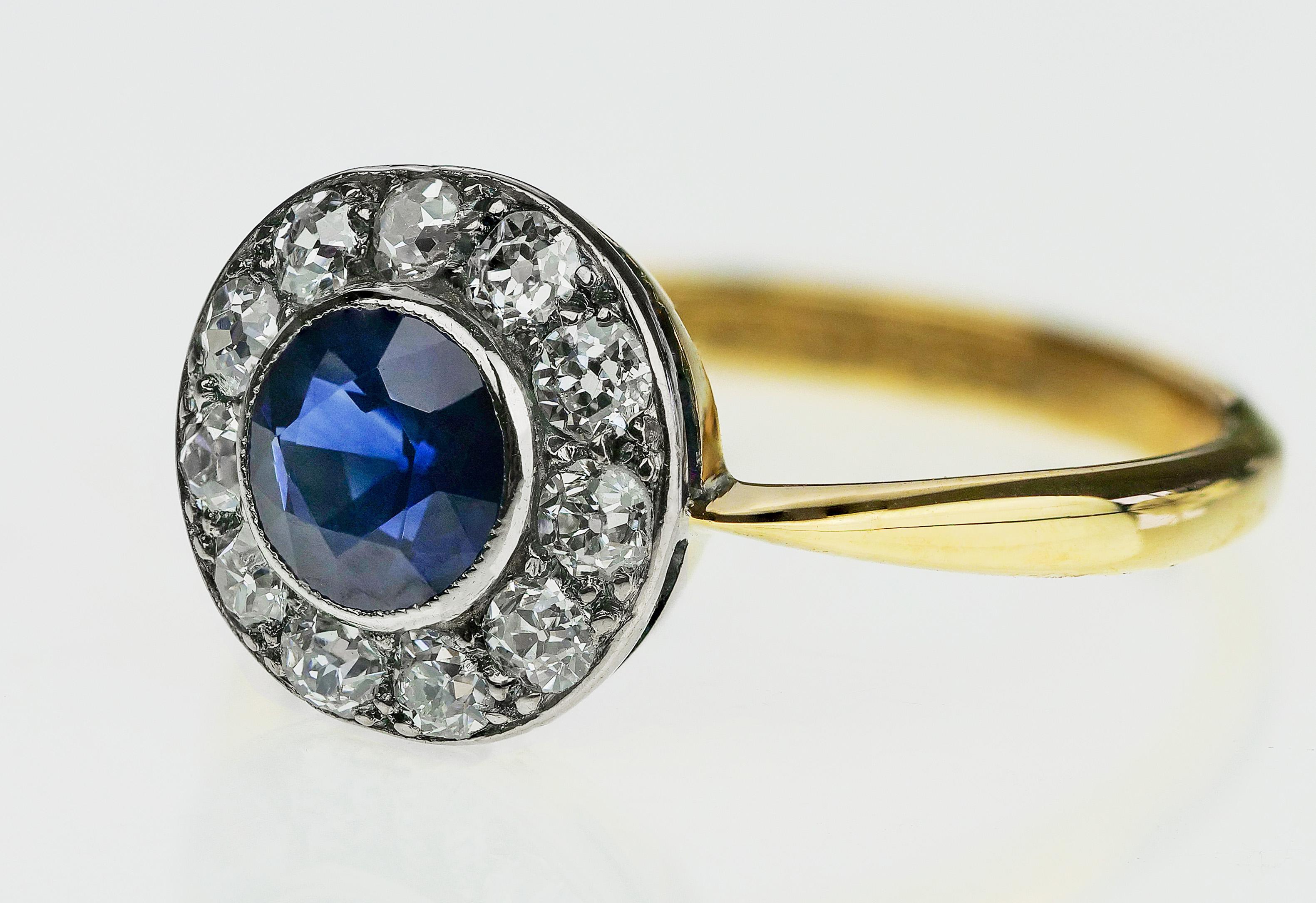 Sapphire and diamond cluster ring in 18 ct yellow gold and platinum. Sapphire is surrounded by 11 old European cut diamonds, the white diamonds sparkles and complements the blue colour sapphire.
1 x round Sapphire, approximate weight 0.75 carats
11