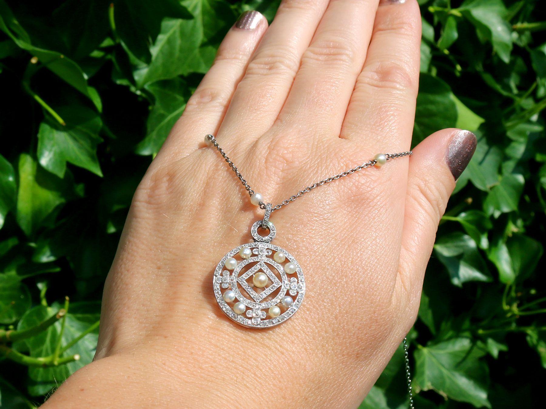 A stunning antique seed pearl, 1.11 carat diamond and platinum pendant on a vintage pearl and 14 karat white gold chain; part of our diverse antique jewelry collections.

This stunning, fine and impressive antique diamond and pearl pendant has been