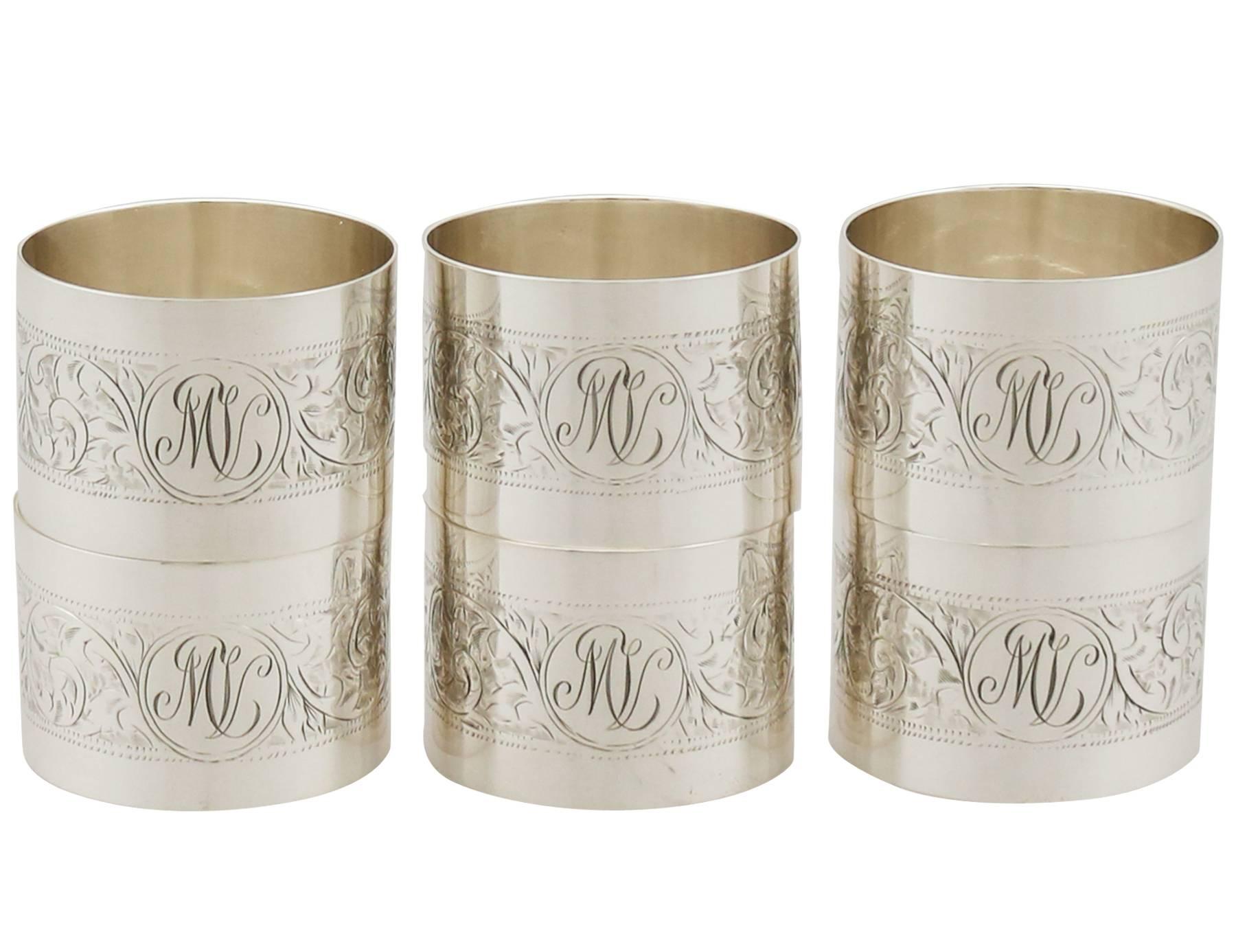 An exceptional, fine and impressive set of six antique George V English sterling silver napkin rings - boxed; an addition to our dining silverware collection.

This exceptional set of antique George V silver napkin rings consists of six napkin