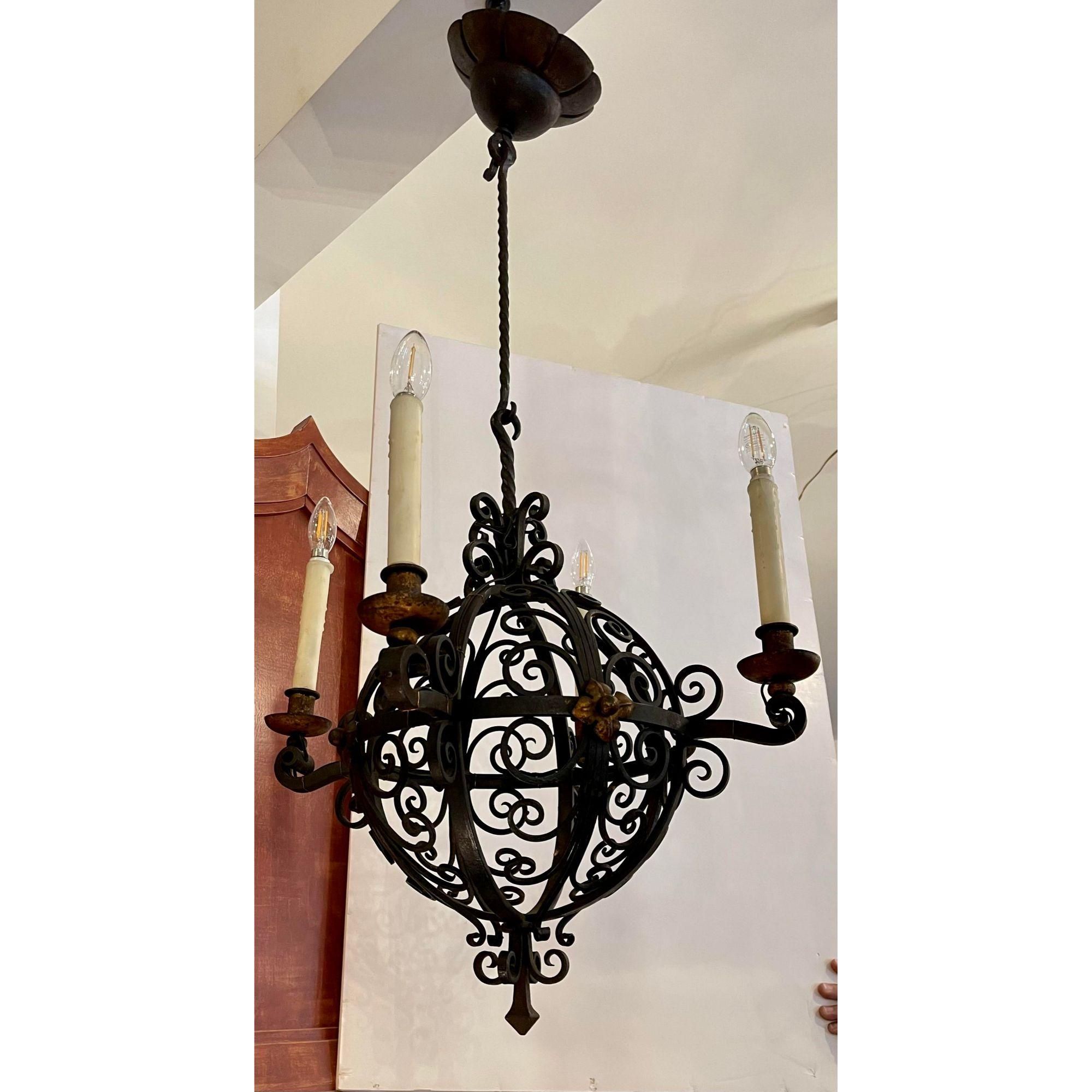 Antique Spanish Colonial Wrought Iron Chandelier

Additional information: 
Materials: Iron, Lights
Color: Black
Period: 1920s
Styles: Spanish Colonial
Power sources: Up to 120V (US Standard)Hardwired
Item Type: Vintage, Antique or