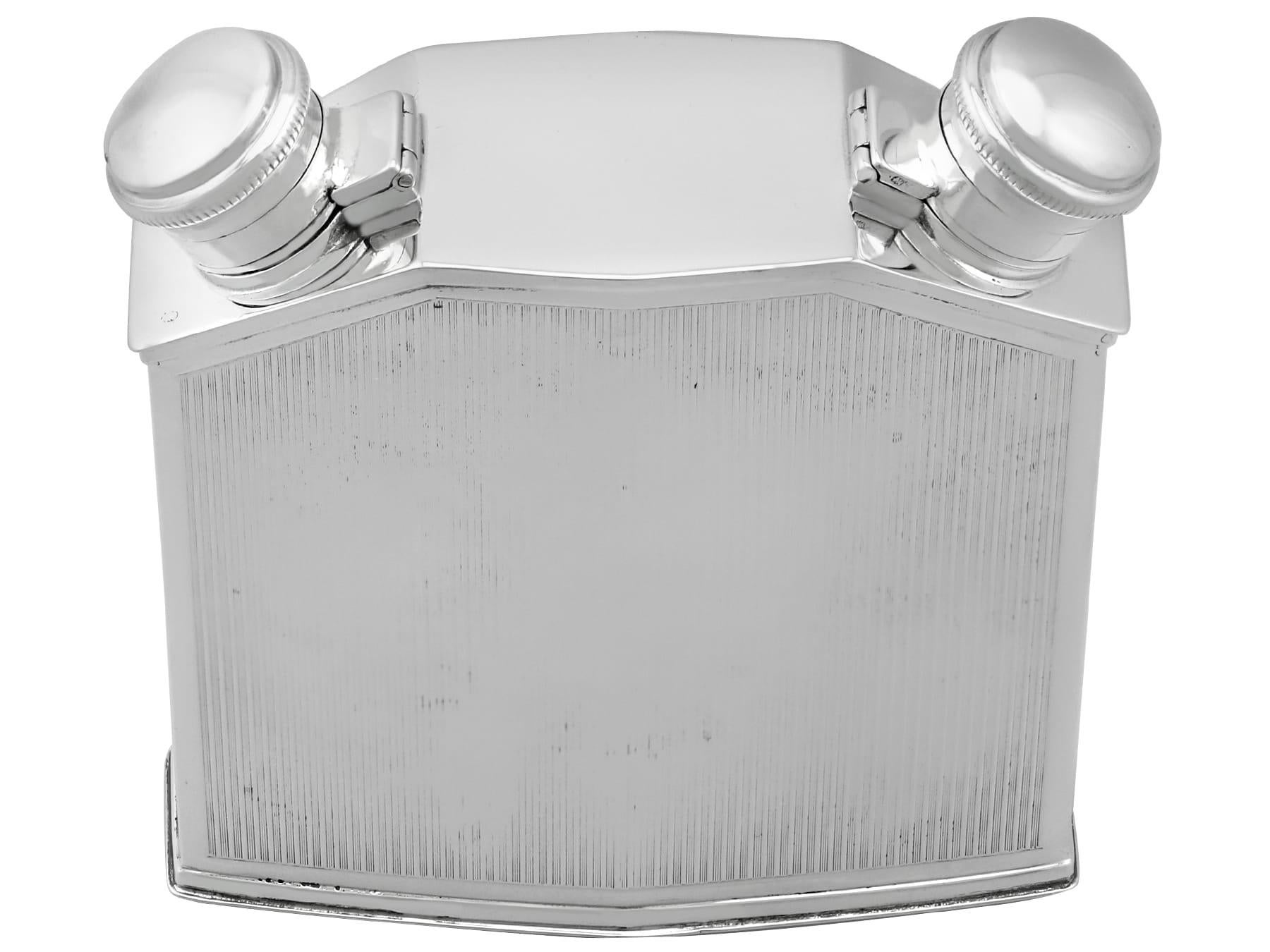 An exceptional, fine and impressive antique George V English sterling silver double hip flask in the form of a car radiator; an addition to our wine and drinks related silverware collection.

This exceptional antique George V sterling silver hip