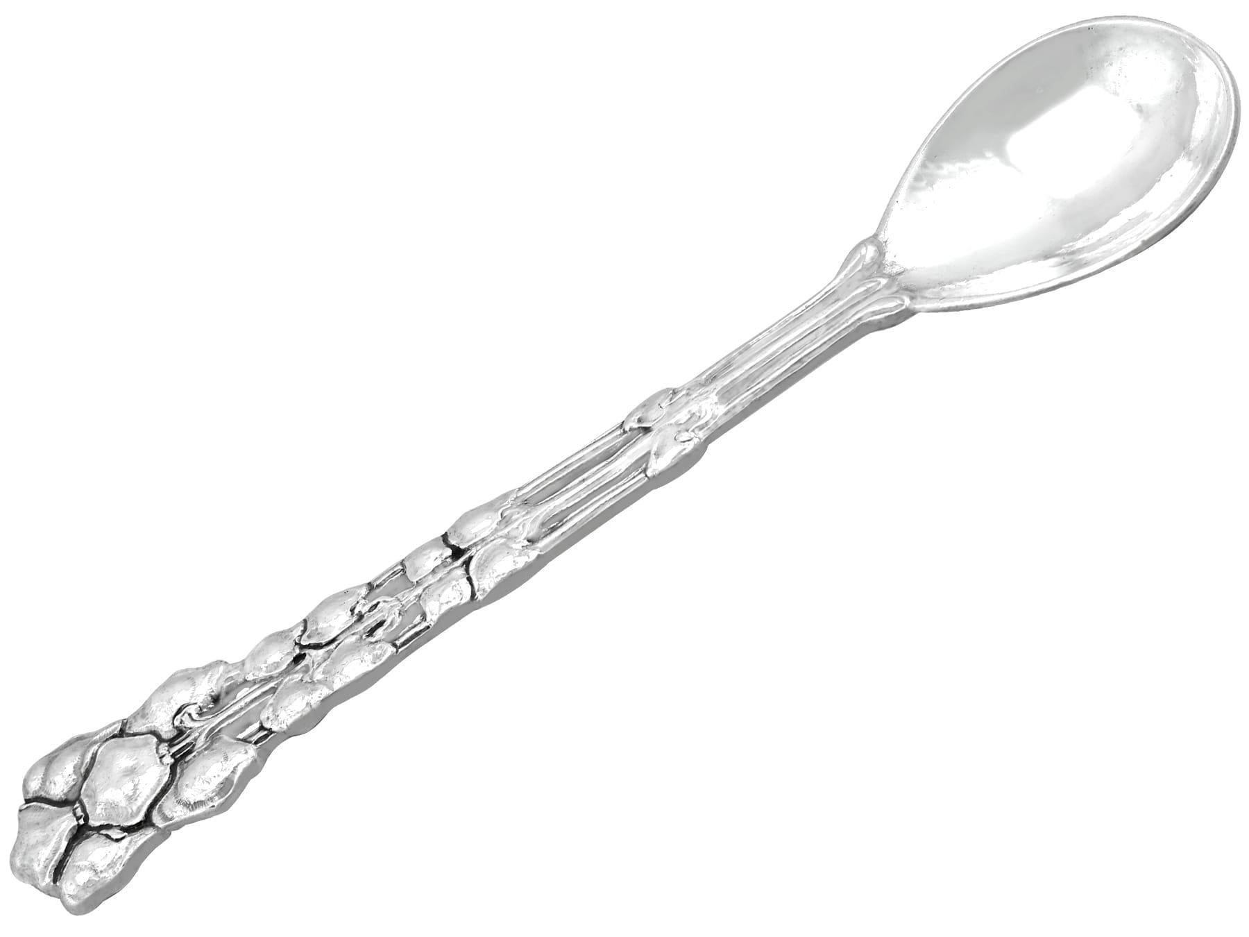 An exceptional, fine and impressive antique George V English cast sterling silver presentation spoon made by Alwyn Carr; an addition to our Arts and Crafts silverware collection

This exceptional antique George V cast sterling silver spoon has a
