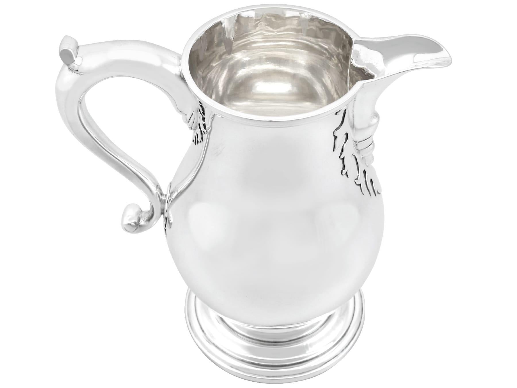 An exceptional, fine and impressive antique George V English sterling silver beer / water jug; part of our antique dining silverware collection

This exceptional antique 20th century sterling silver beer/water jug has a plain baluster form onto a