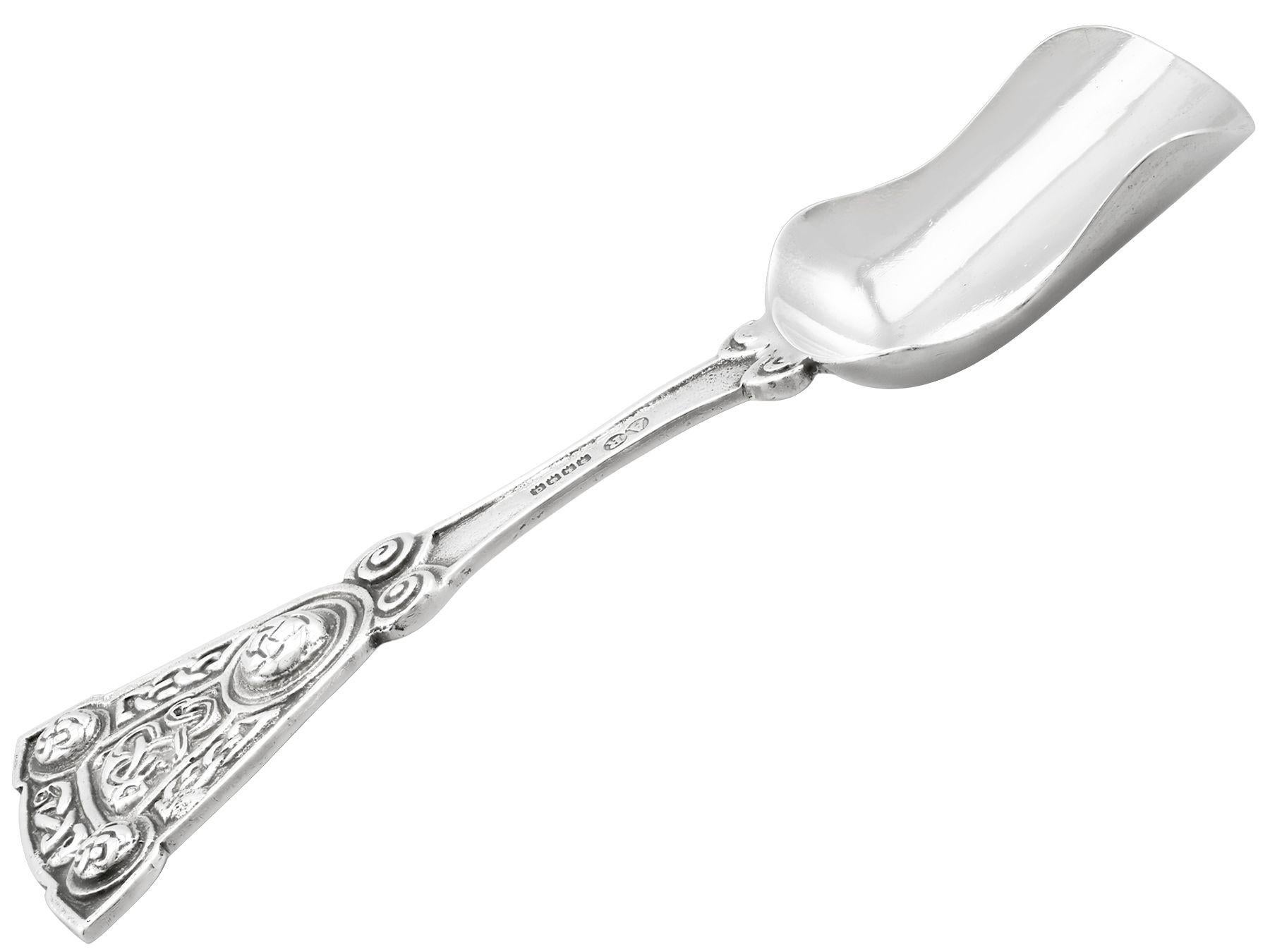 An exceptional, fine and impressive antique George V Scottish sterling silver caddy spoon; an addition to our teaware collection.

This exceptional antique George V Scottish sterling silver caddy spoon has a plain shovel shaped bowl.

The handle