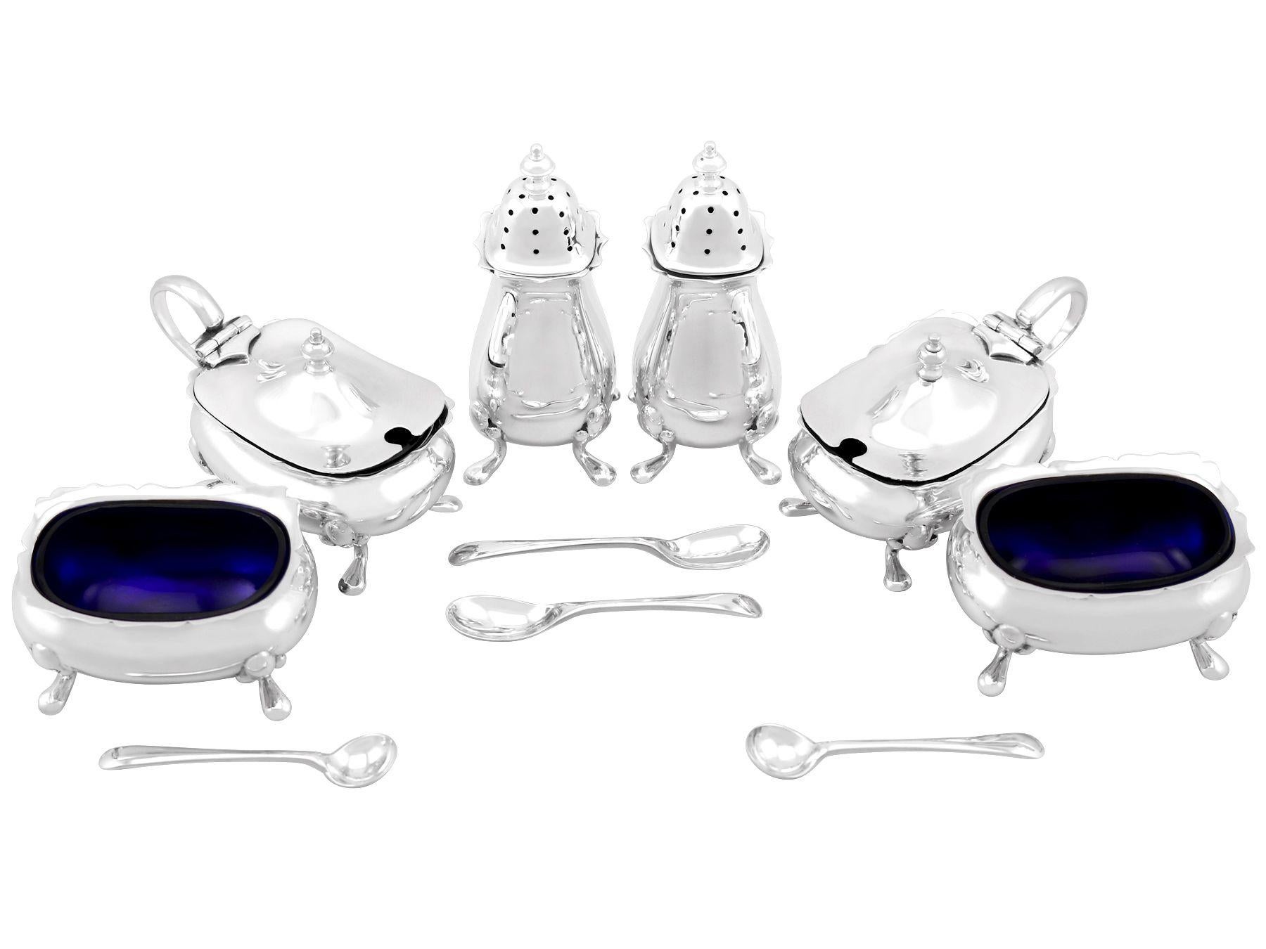 An exceptional, fine and impressive antique George V English sterling silver six piece condiment set - boxed; an addition to our dining silverware collection.

This exceptional antique George V six piece sterling silver condiment set consists of