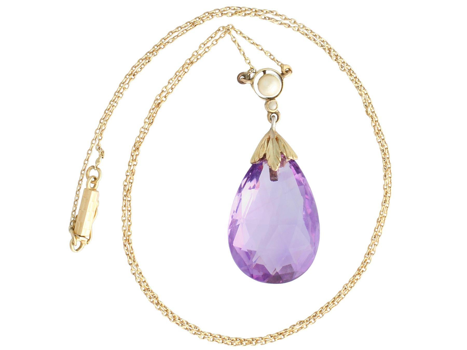 A fine and impressive antique 16.21 carat amethyst and seed pearl, 14 karat yellow gold necklace; part of our diverse antique jewelry and estate jewelry collections.

This fine and impressive amethyst drop necklace has been crafted in 14k yellow