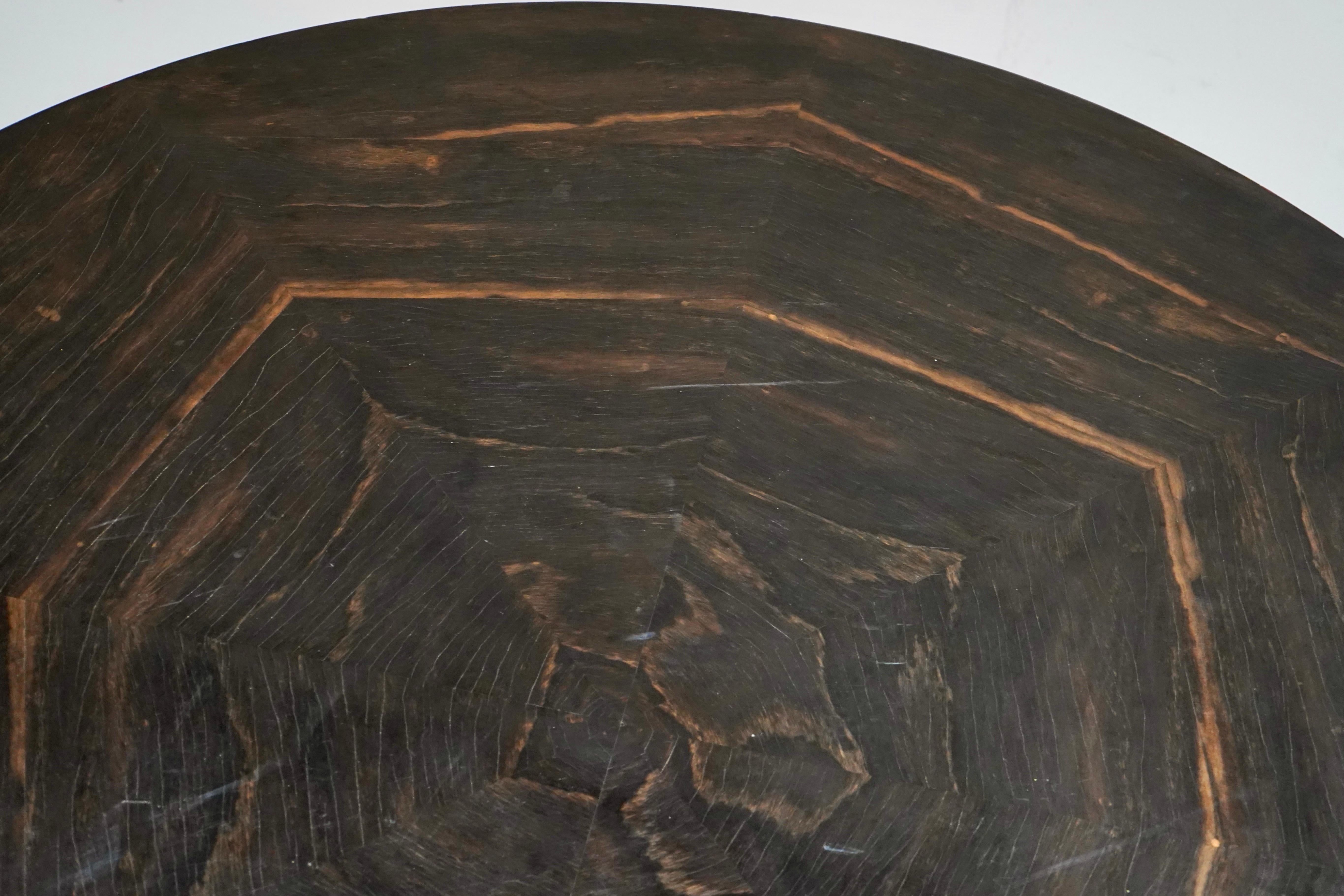
Early 20th century ebonised centre table.
Circular top on a turned plinth base. 
Quality piece of furniture that could be a stunning centre table or dining table. 
Old label on the underside.


Condition 
Please do take a careful look at all our
