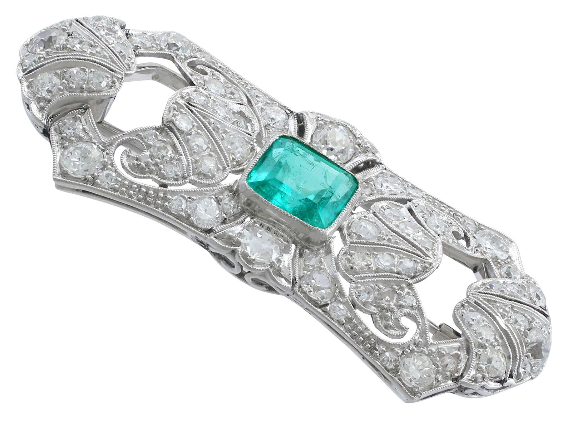 A stunning, fine and impressive 2.50 carat natural emerald and 3.03 carat diamond brooch in 9 karat white gold with platinum settings; part of our antique jewelry collections

This stunning, fine and impressive antique emerald brooch has been