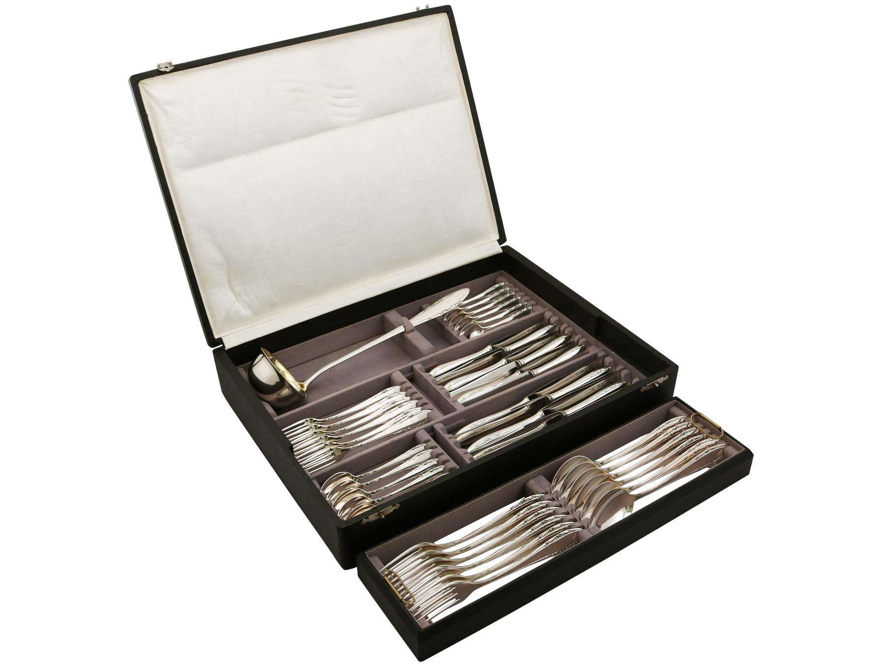 A fine and impressive antique German silver straight flatware service for six persons - boxed; an addition to our canteen of cutlery collection.

The pieces of this fine, antique German silver flatware service for six persons have a plain rounded