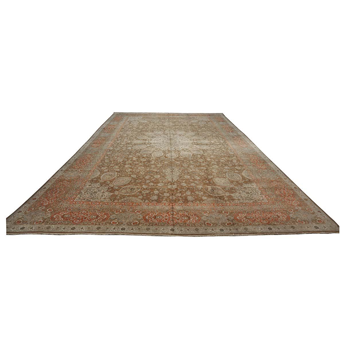 Ashly Fine Rugs presents a 1930s Antique Persian Tabriz 13x20 Oversized Wool Handmade Rug. Tabriz is a northern city in modern-day Iran and has forever been famous for the fineness and craftsmanship of its handmade rugs. This piece has a brown