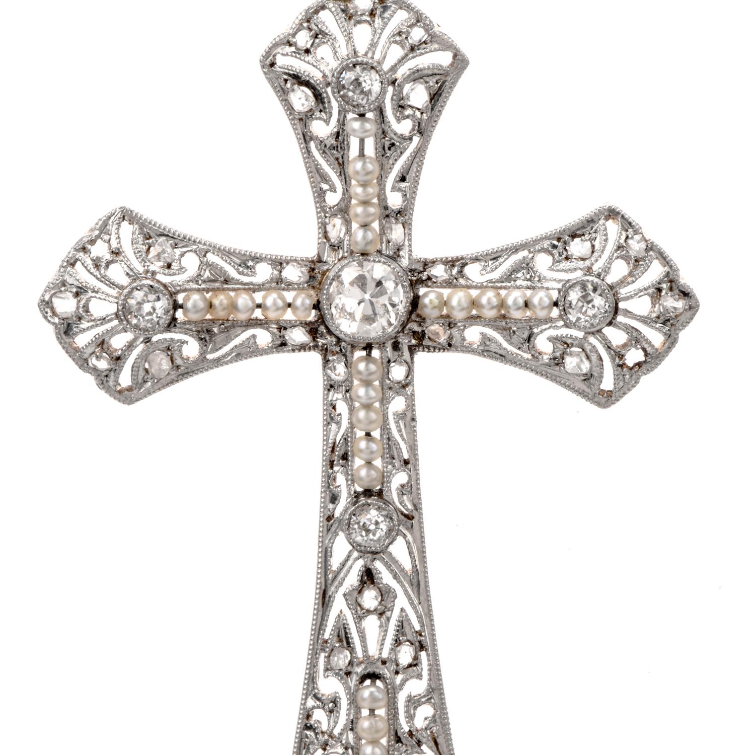 Antique 1930's  Diamond and Pearl  pendant were inspired in a Cross design and crafted in 18K Gold and solid platinum top.

Diamonds anchor the span of Pearls that run throughout the center of the elegantly designed Filagree work.

Diamonds weigh