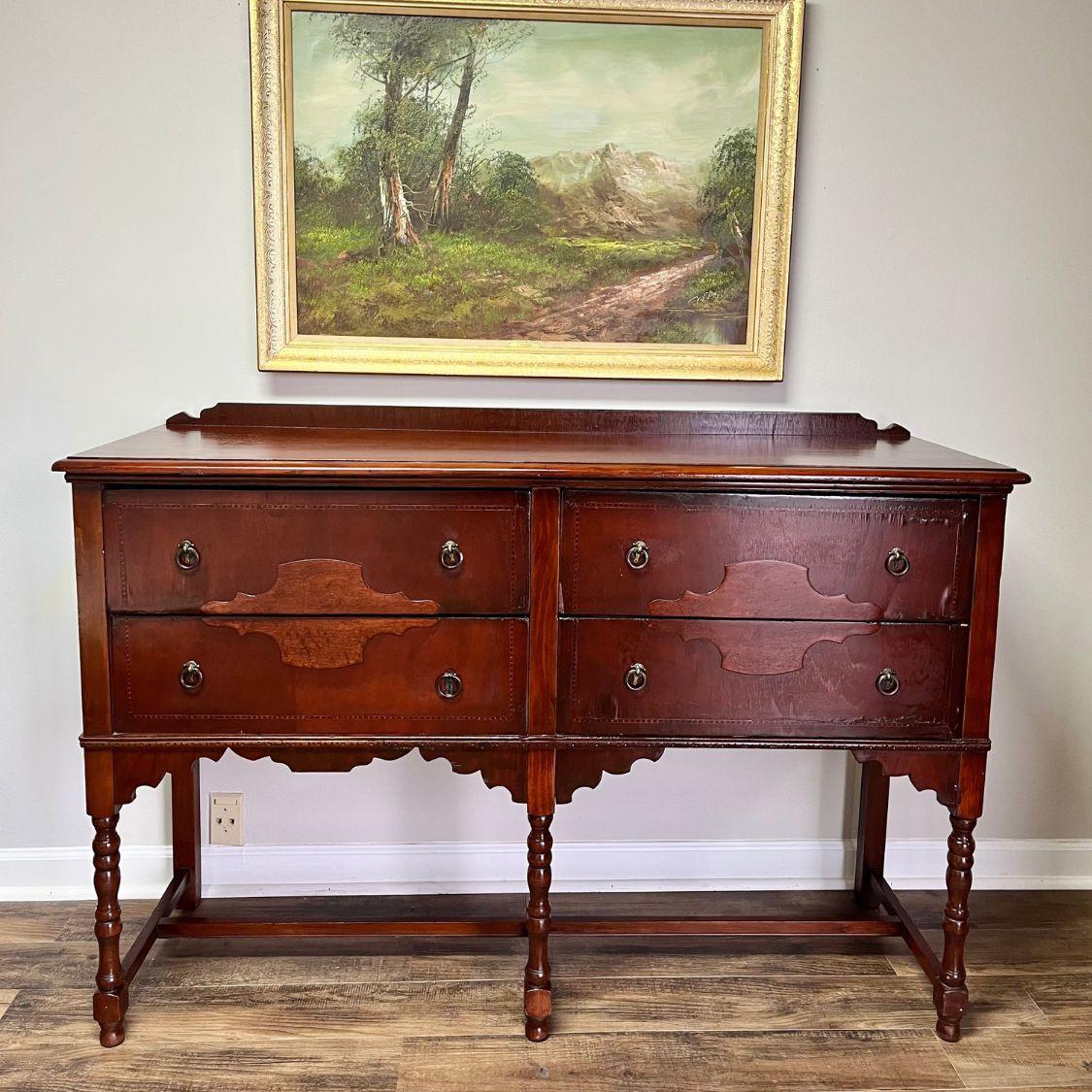 Gorgeous 1930s four drawer sideboard. Each drawer front is finely constructed with English dovetail joints. Features beautiful spindle legs.
Would be beautiful used in a dining room to give you more space to serve and store extra dinnerware. Also