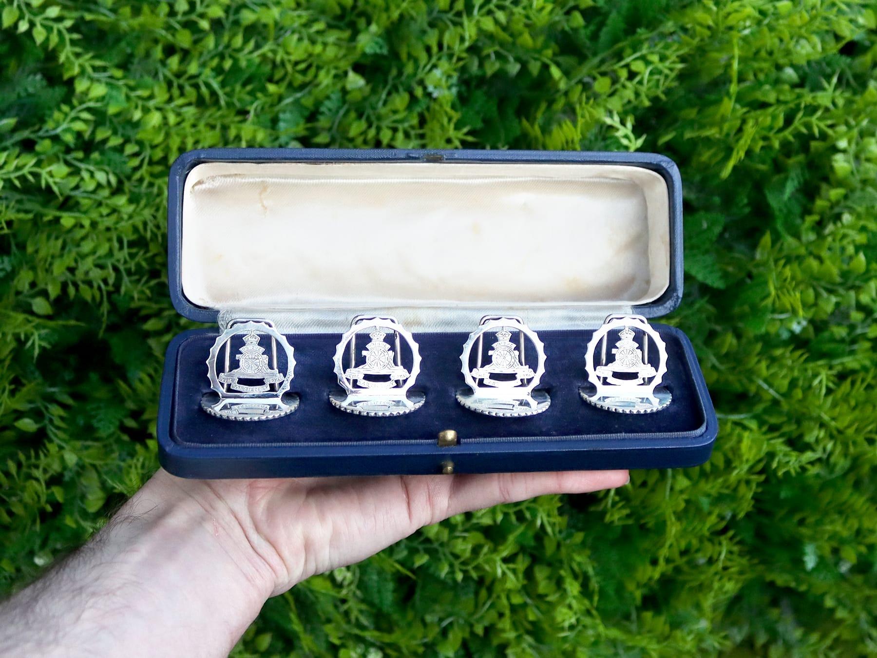 An exceptional, fine and impressive set of four antique George V English sterling silver Royal Artillery menu holders, boxed, an addition to our 1930s silverware collection.

These exceptional George V cast sterling silver menu holders have a