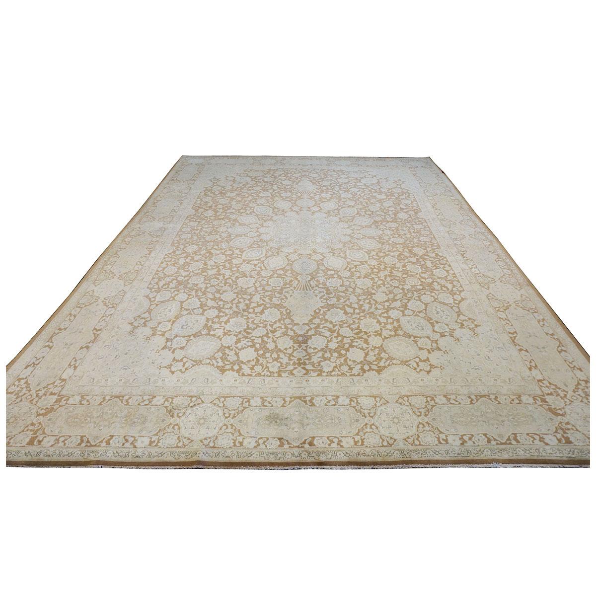 Ashly Fine Rugs presents a 1940s Antique Persian Tabriz 10x13 Wool Handmade Rug. Tabriz is a northern city in modern-day Iran and has forever been famous for the fineness and craftsmanship of its handmade rugs. These rugs are better known as the
