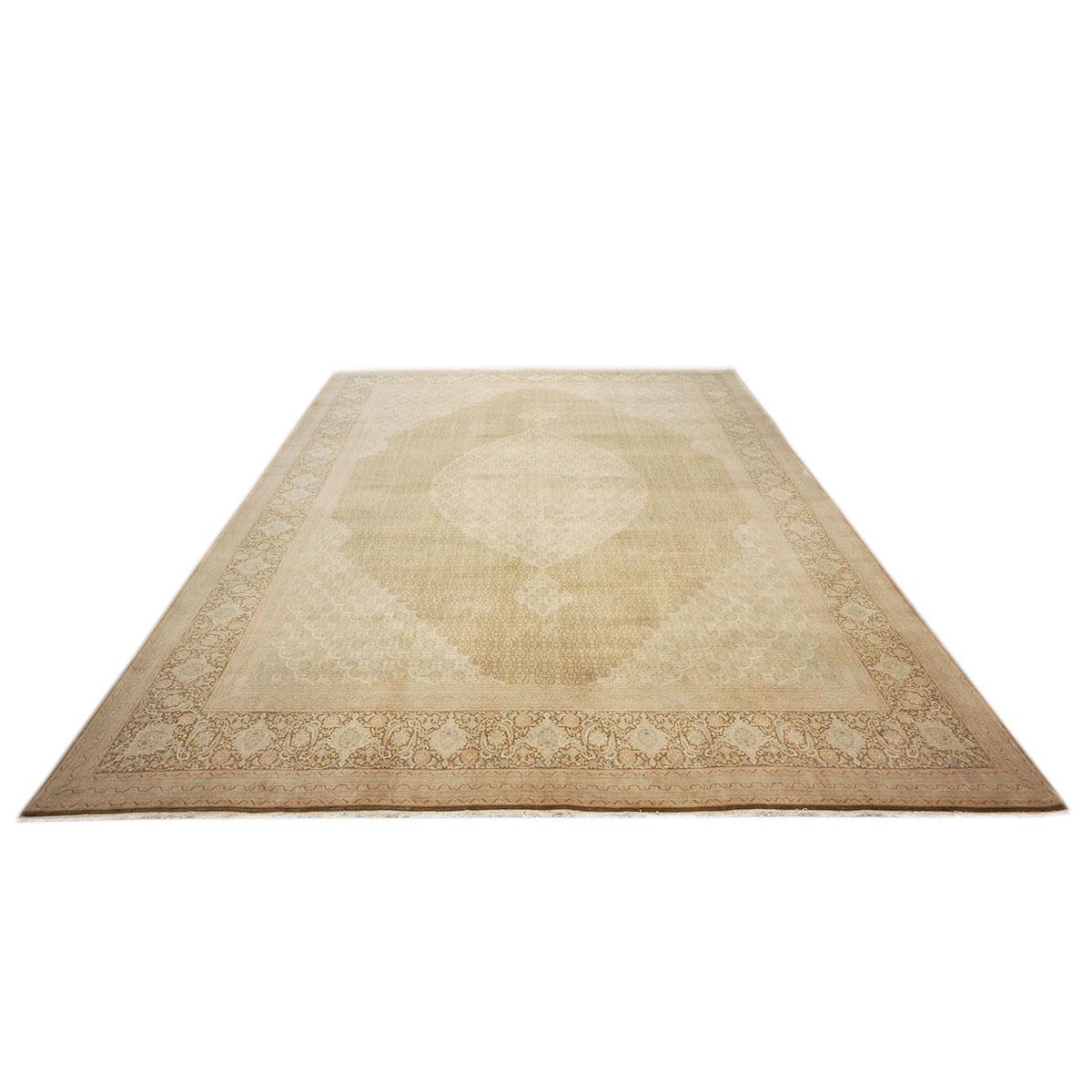 Ashly Fine Rugs presents a 1940s Antique Persian Tabriz Wool Handmade Rug. Tabriz is a northern city in modern-day Iran and has forever been famous for the fineness and craftsmanship of its handmade rugs. These rugs are better known as the Pahlavi