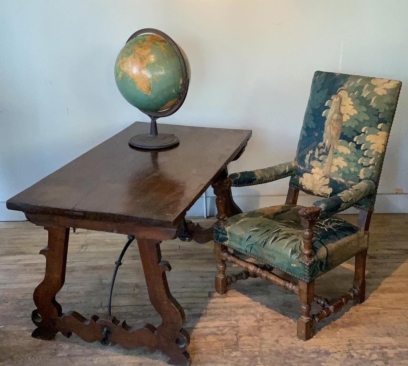 A beautiful antique late 1940's desktop globe by Denoyer-Geppert. with a heavy cast iron base, and iron rotating ring as well. the globe is in very good condition, with a lovely patina. marked Denoyer-Geppert.