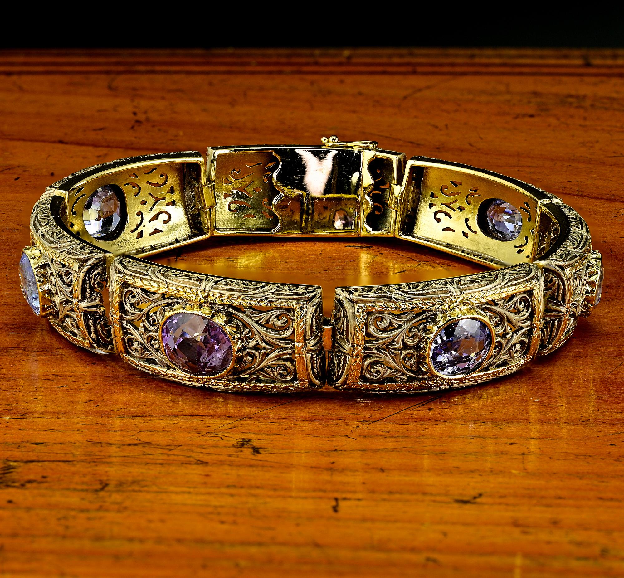 This outstanding antique bracelet is 1930 circa – 18 KT solid gold topped by silver
Elegant workmanship artful rendered in fine panels with arabesque and floral motifs skilfully carved on silver upon
Adorned with a selection of 7 natural untreated
