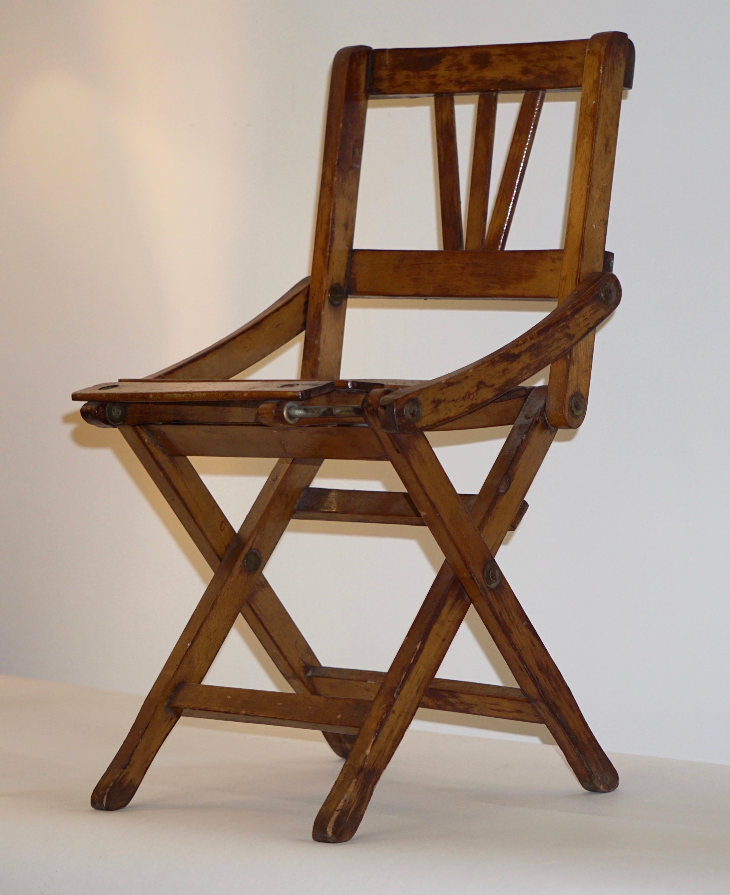 A charming model of a folding chair, entirely handmade in Italy in oak, 
quality of construction and attention to details, in excellent original condition. A decorative item to bring fun or can be used as a doll chair.