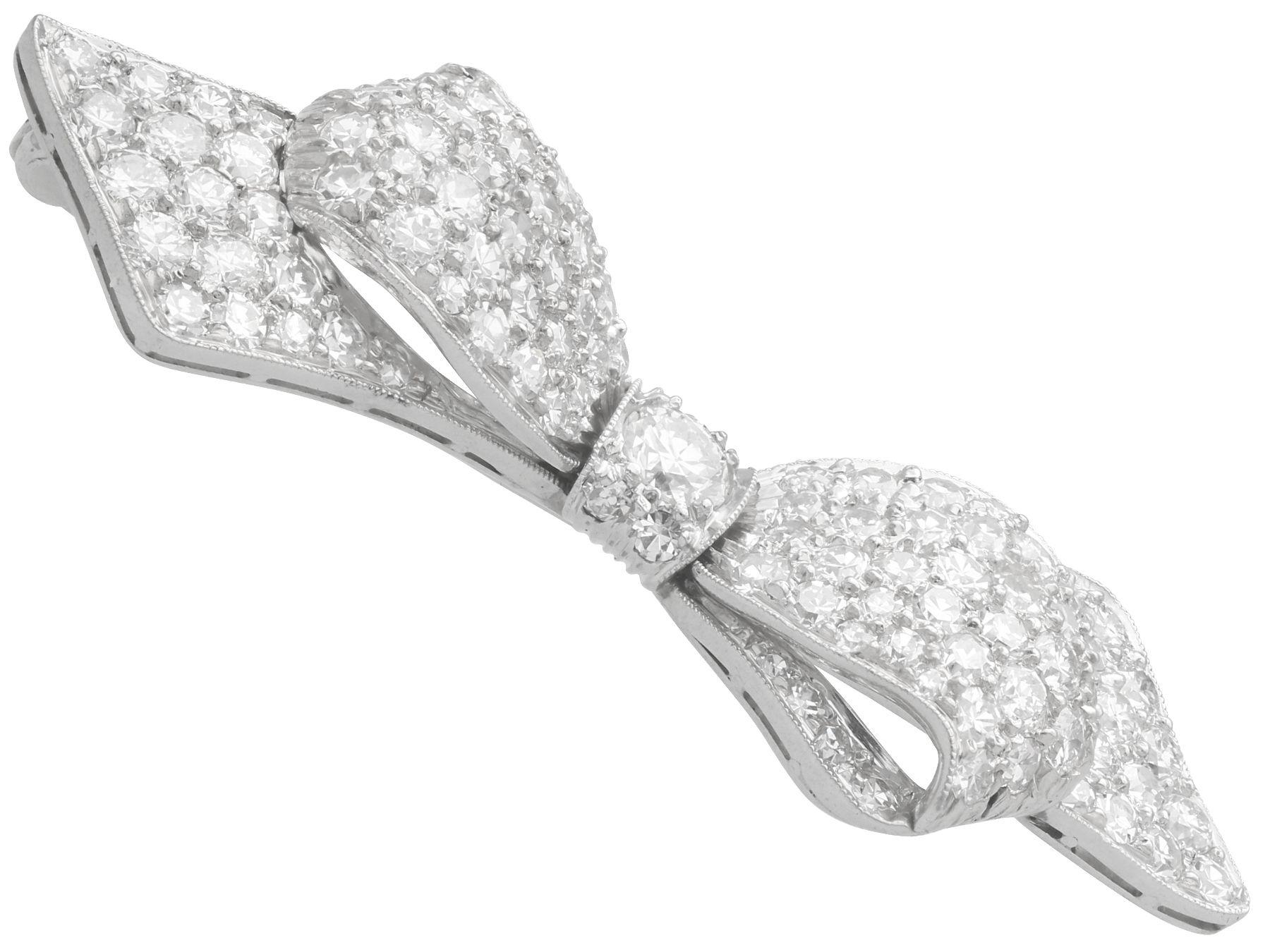 A stunning, fine and impressive 1.99 carat diamond and platinum bow brooch; part of our antique jewelry and estate jewelry collections

This stunning, fine and impressive antique diamond brooch has been crafted in platinum.

The brooch has been