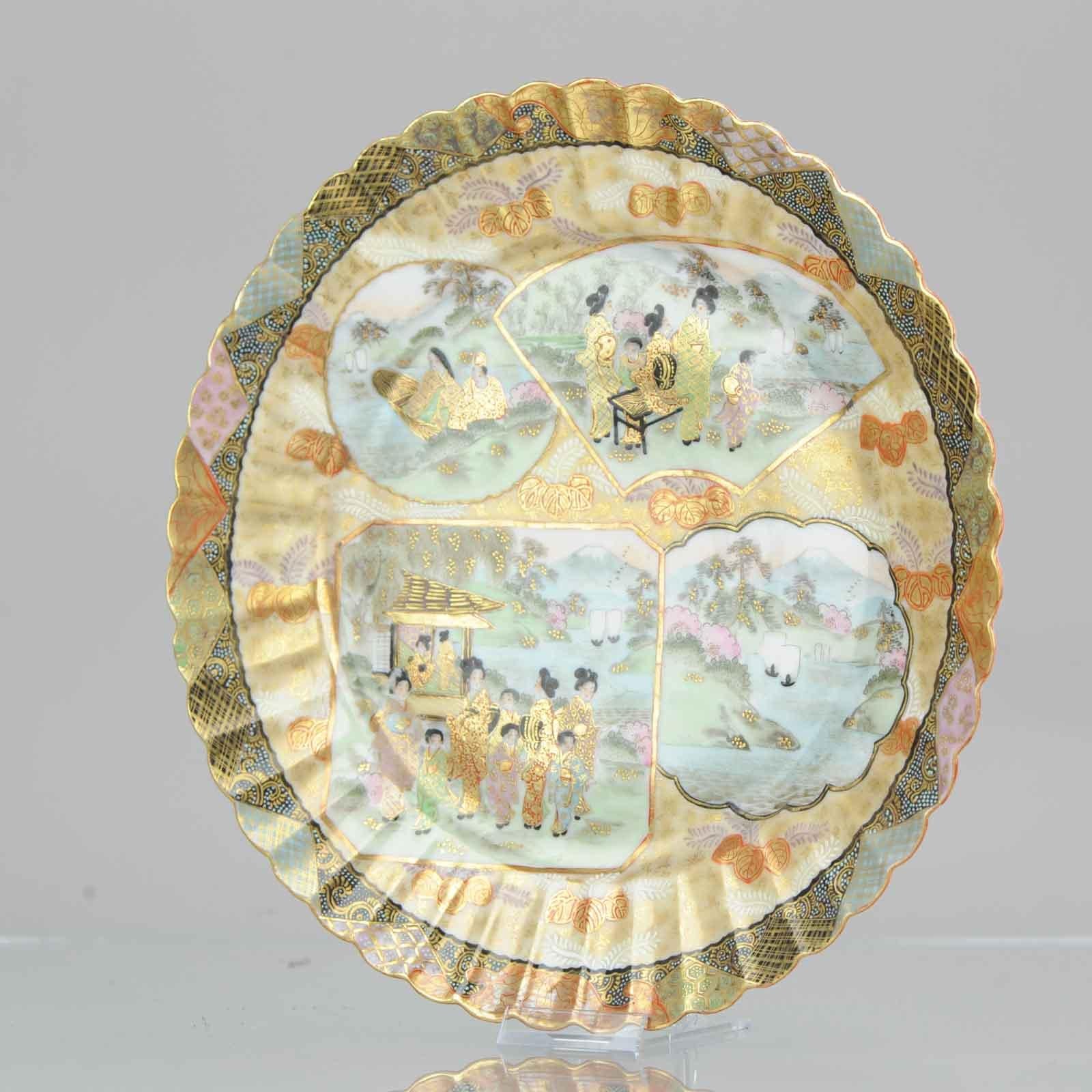 Fabulous Japanese dish. 19th century porcelain in Satsuma style. I think it is actually Kutani but the decoration is very much a reference to Satsuma ware. Fully decorated compartsments of figures and boats in a landscape. rest of the dish with