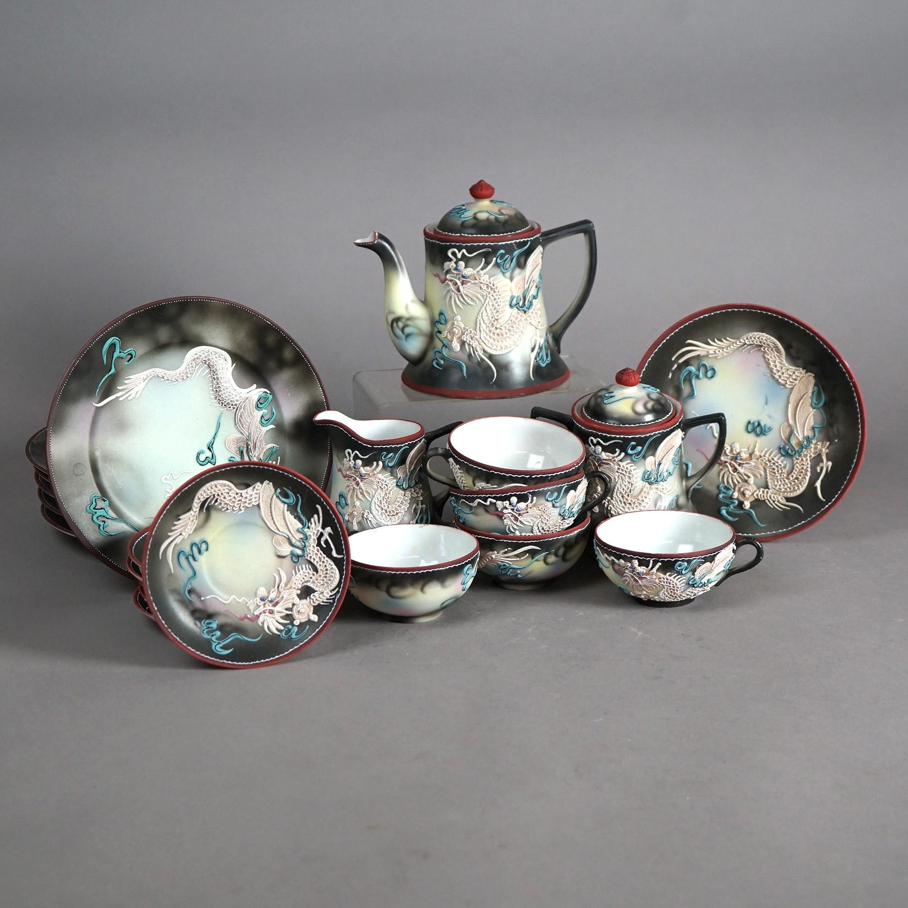 Antique 19-Piece Japanese Nippon Hand Painted Moriage Eggshell Porcelain Dragonware Tea Set c1920

Measures- Creamer cup: 4''H x 3.5''W x 4.5''D; Sugar Bowl: 5''H x 4''W x 5.5''D; Water Pot: 6''H x 7.5''W x 5.25''D; Six Dinner Plates: 1''H x 8.5''W