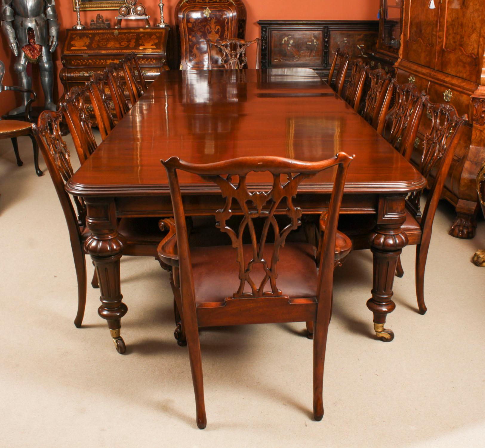 This is a beautiful dining set comprising an antique William IV flame mahogany dining table, Circa 1835 in date, and a beautiful set of twelve Chippendale Revival  dining chairs.
 
This amazing table can seat up to fourteen people in comfort and has