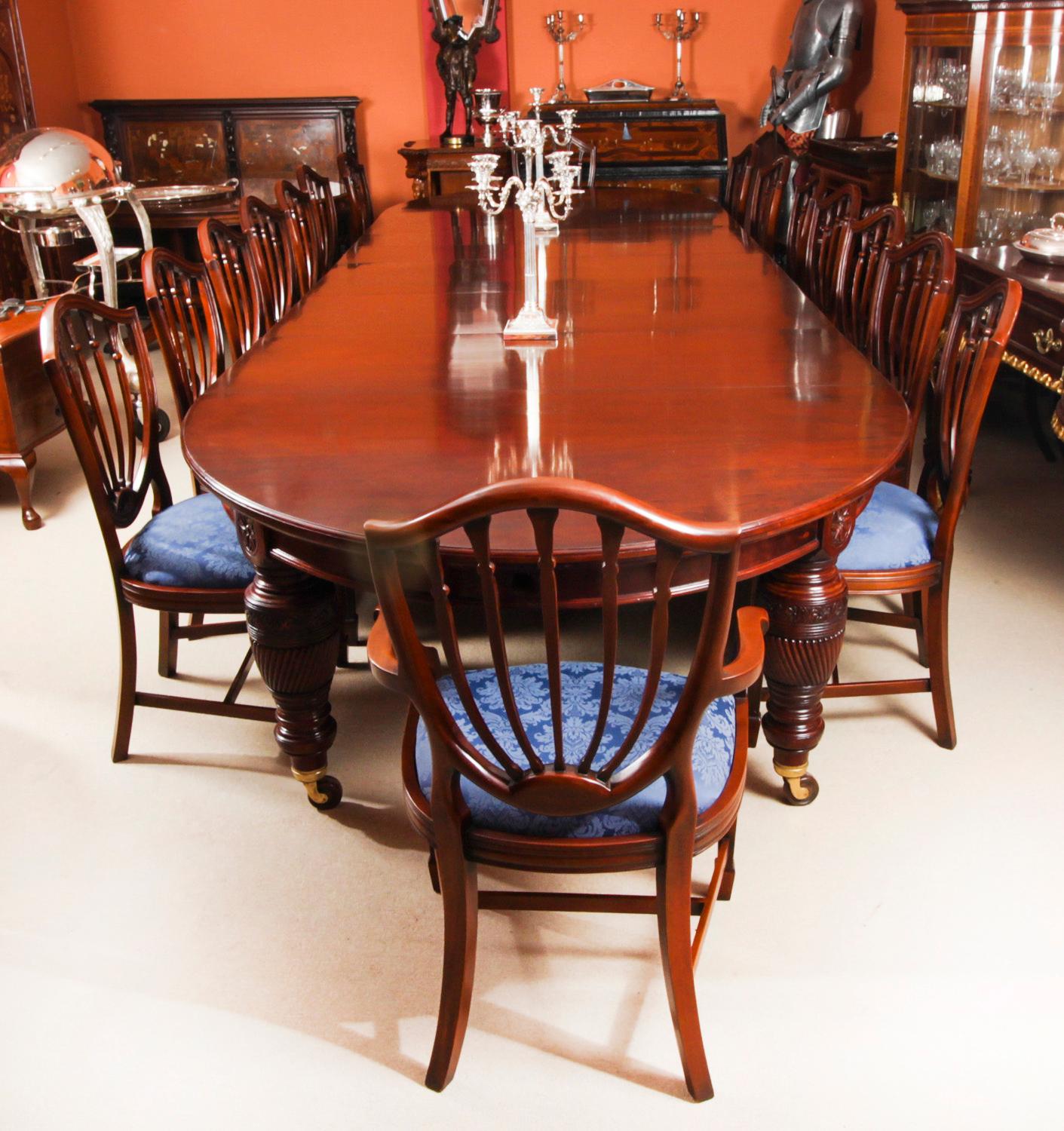 This is a beautiful dining set comprising an antique Victorian flame mahogany dining table, Circa 1880 in date, and a beautiful set of sixteen Hepplewhite Revival dining chairs.

The amazing table can seat sixteen people in comfort and has been