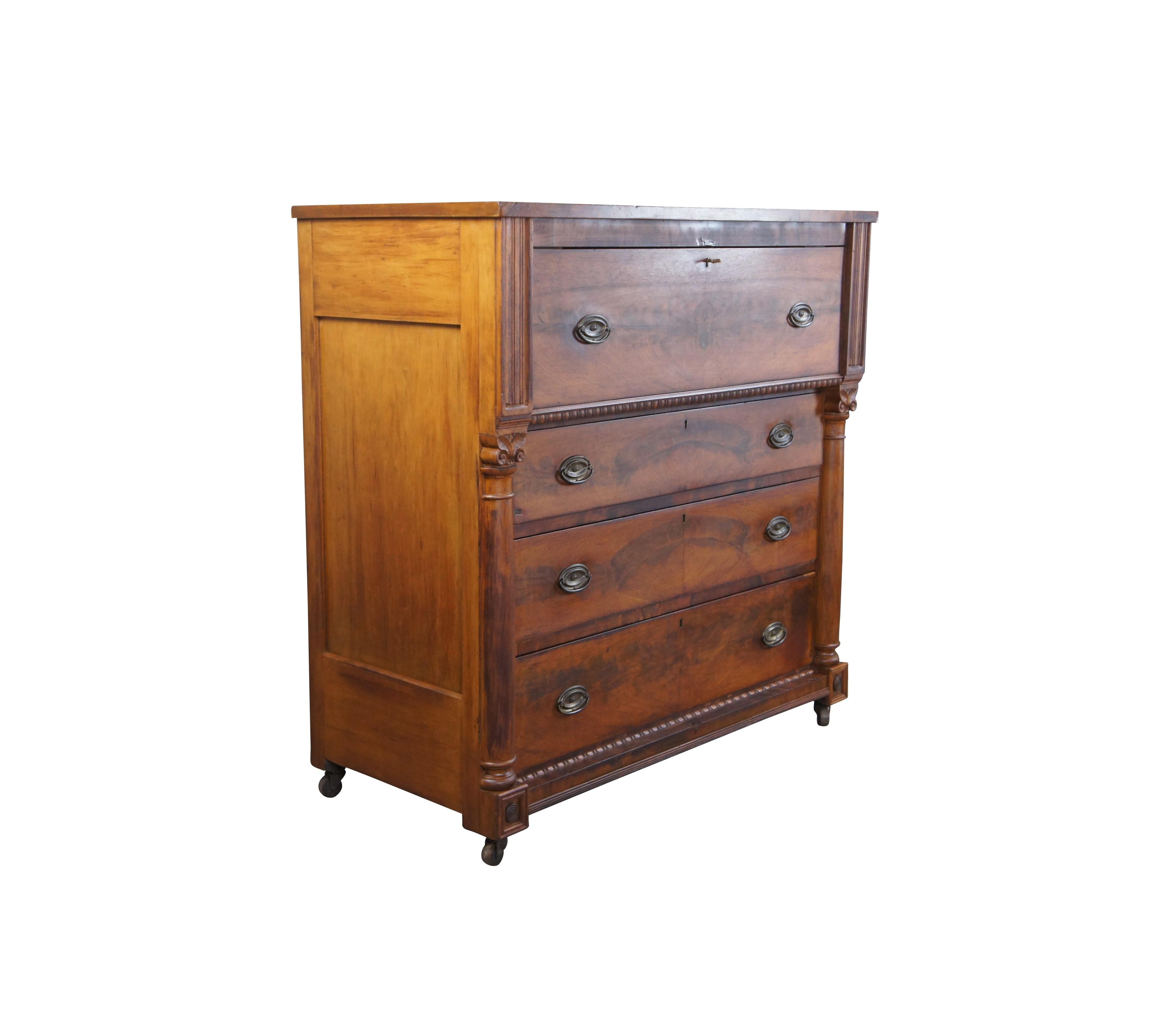 A beautiful Victorian Era tallboy dresser drawing inspiration from Federal styling, circa 1870s. Made from mahogany and cherry with matchbook (burl) veneer front. Features four hand dovetailed drawers with oval brass hardware. The stiles of the case