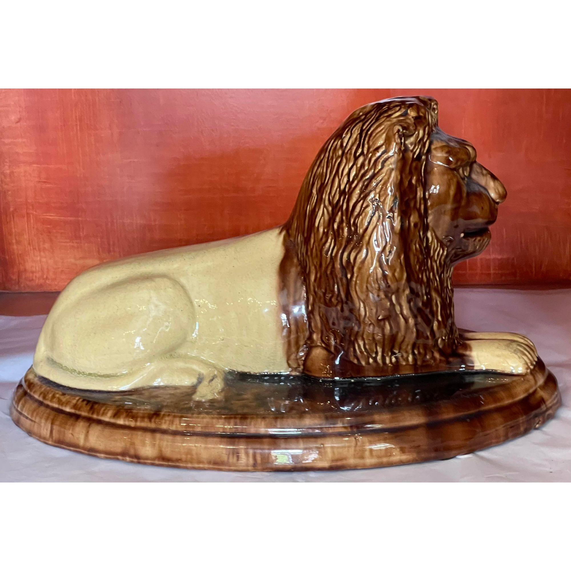 Antique Majolica pottery recumbent lion sculpture. It is very unusual in superb quality majolica pottery with a brown and yellow glaze.

Additional information: 
Materials: pottery.
Color: brown.
Period: 19th century.
Styles: English, French