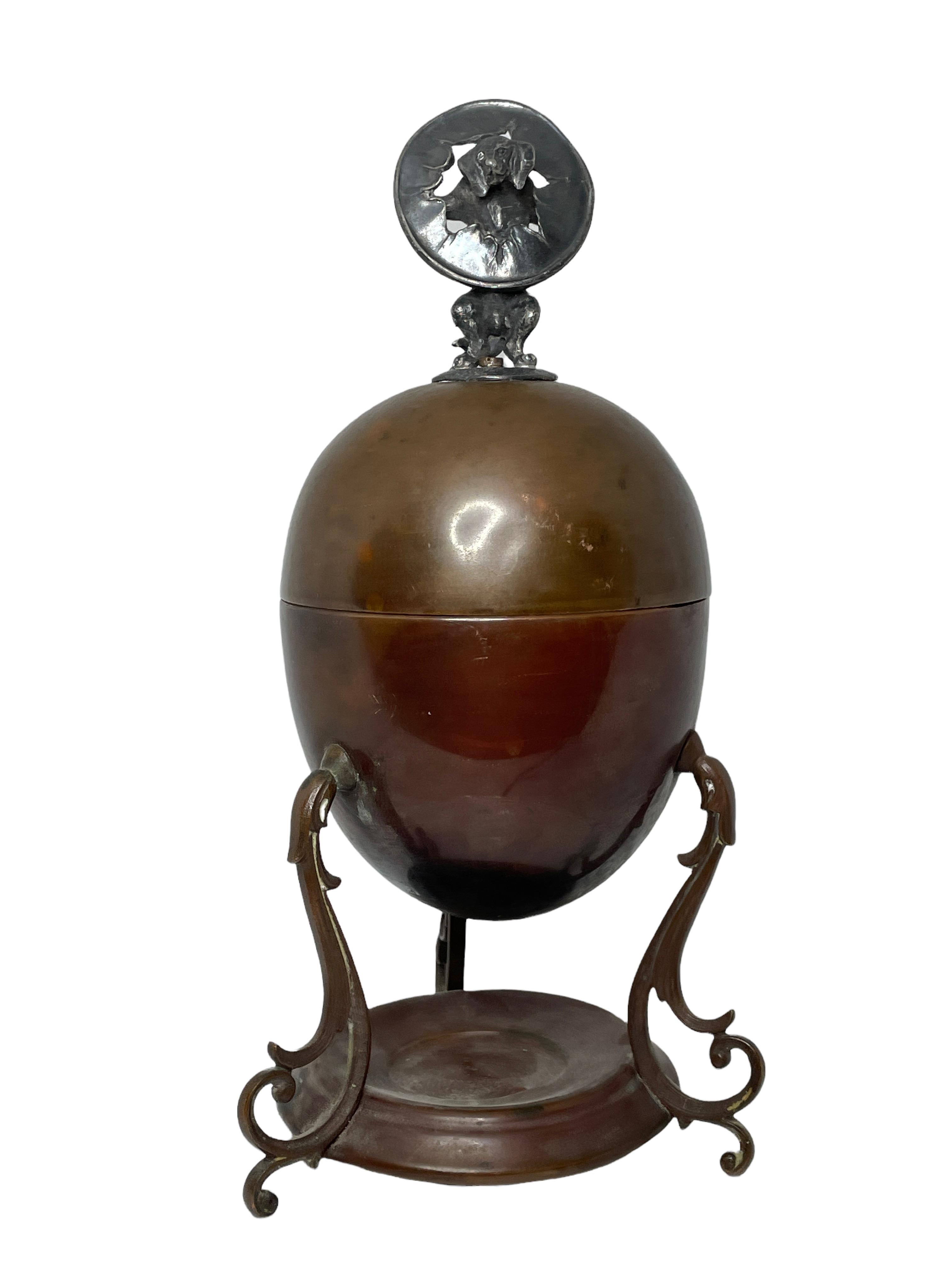 This is a lovely example of how the Victorians had a piece of kit for just about everything.

This is an egg coddler, or egg boiler. Something that would grace an elegant breakfast table.

Consisting of a two part egg shaped container on 3
