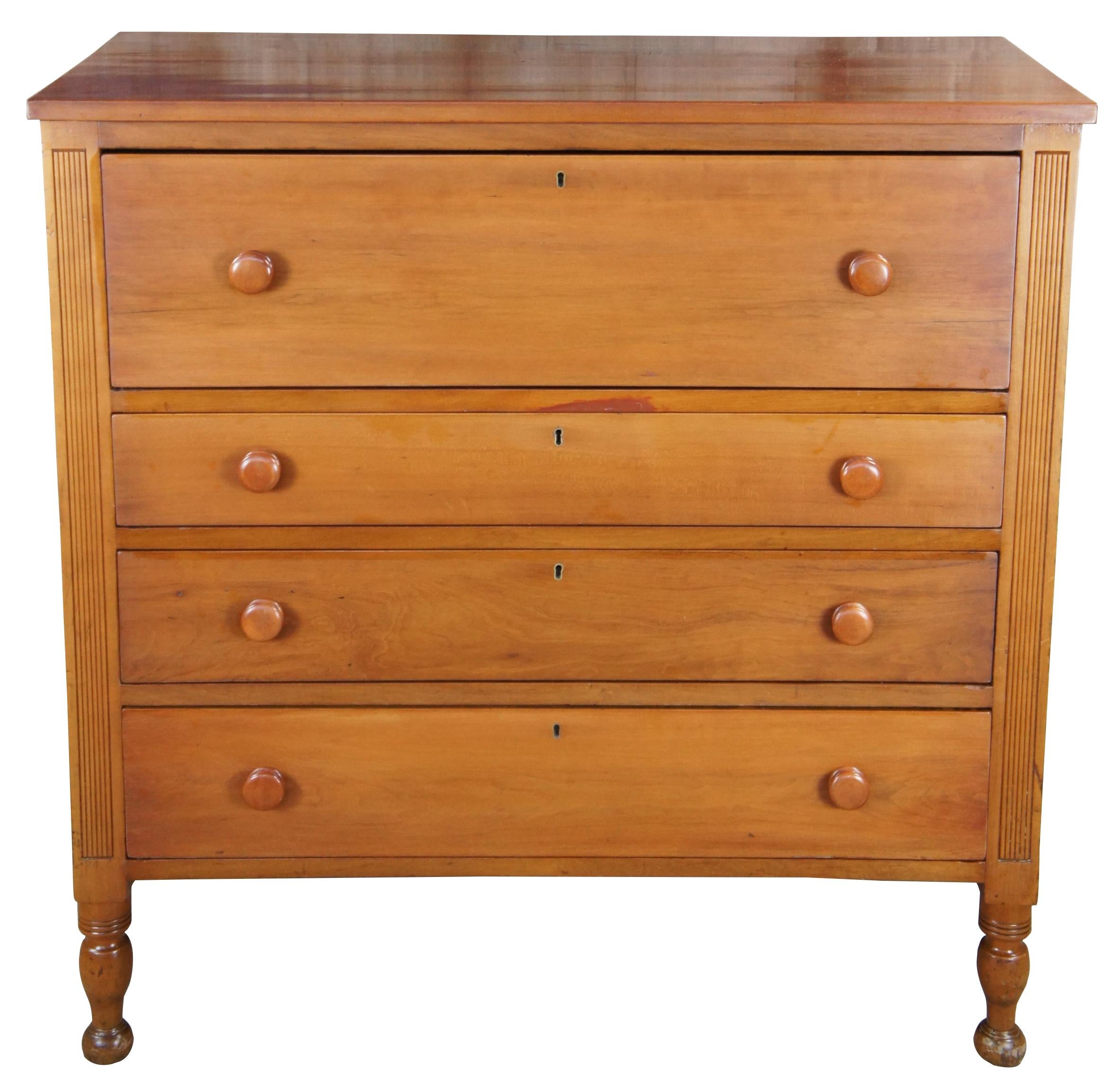 Impressive American tallboy dresser, circa 1840s (late Federal Era). A rectangular form made from solid cherry with four hand dovetailed drawers, fluted stiles and turned ribbed turnip feet. Includes lockable drawers and smooth lathed drawer pulls.