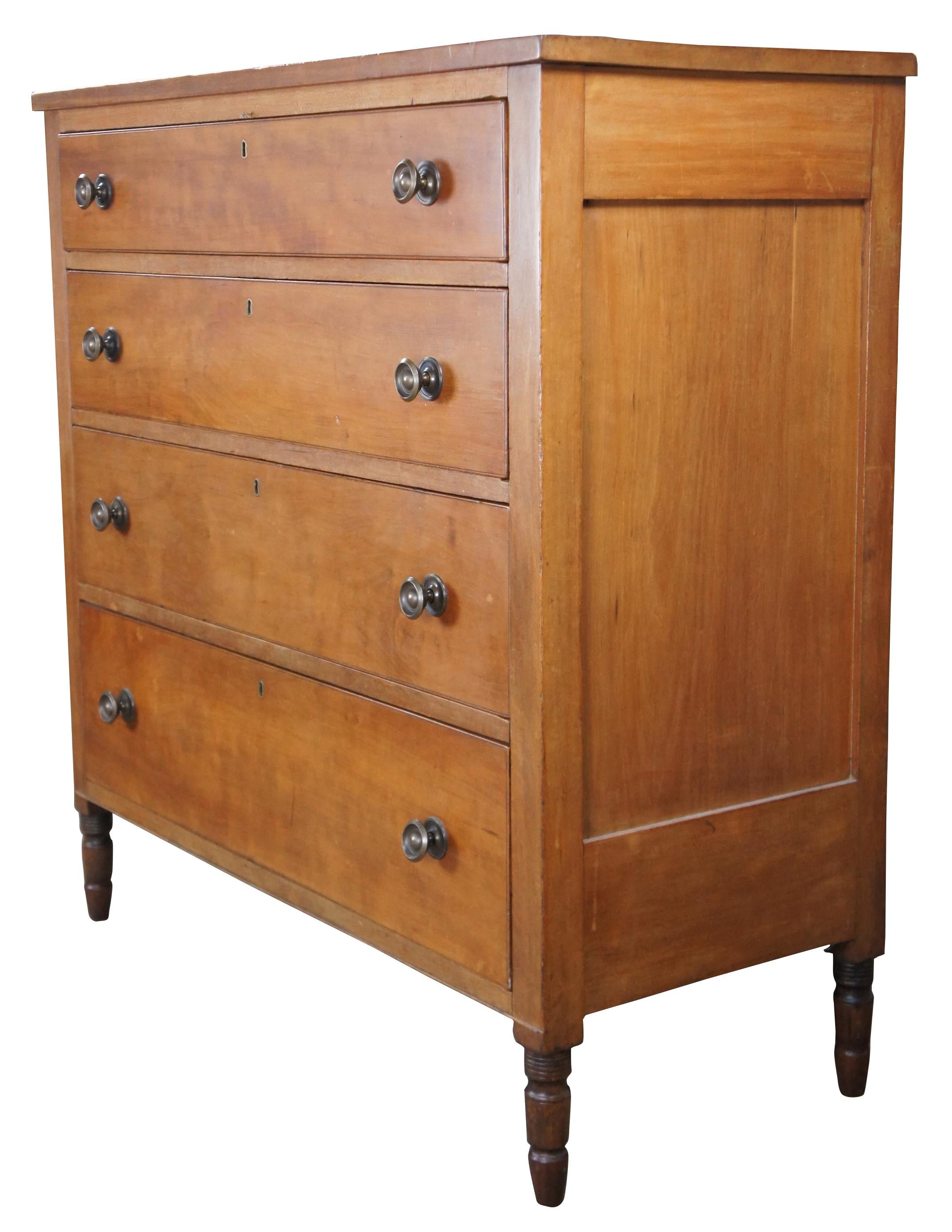 Impressive American tallboy dresser, circa 1850s. A rectangular form made from solid cherry with four graduated hand dovetailed drawers with brass hardware, turned ribbed and arrow feet.
 