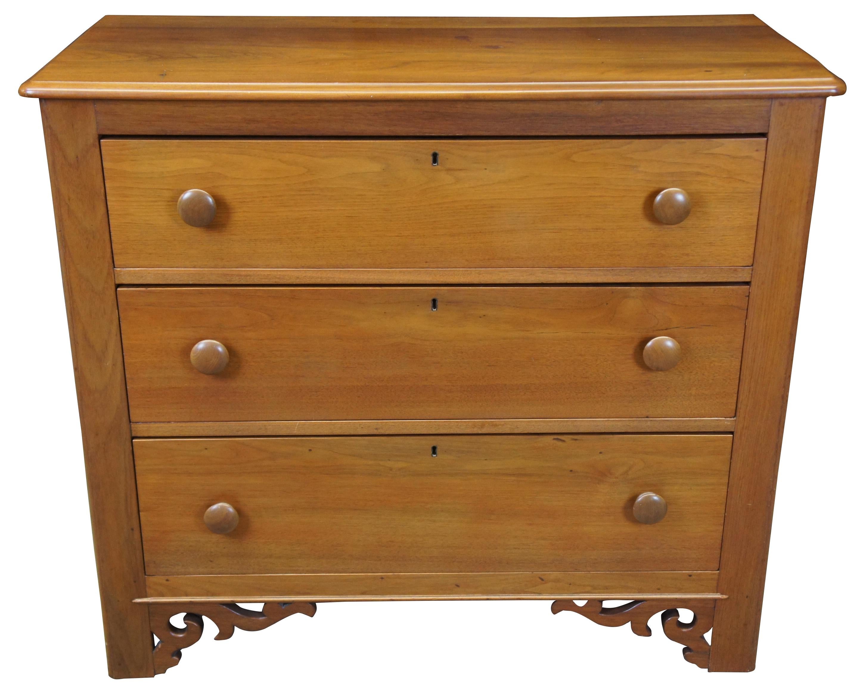 Late 19th century American walnut three-drawer chest with glove box drawers. Hand dovetailed with scrolled accents along lower apron.
   
  