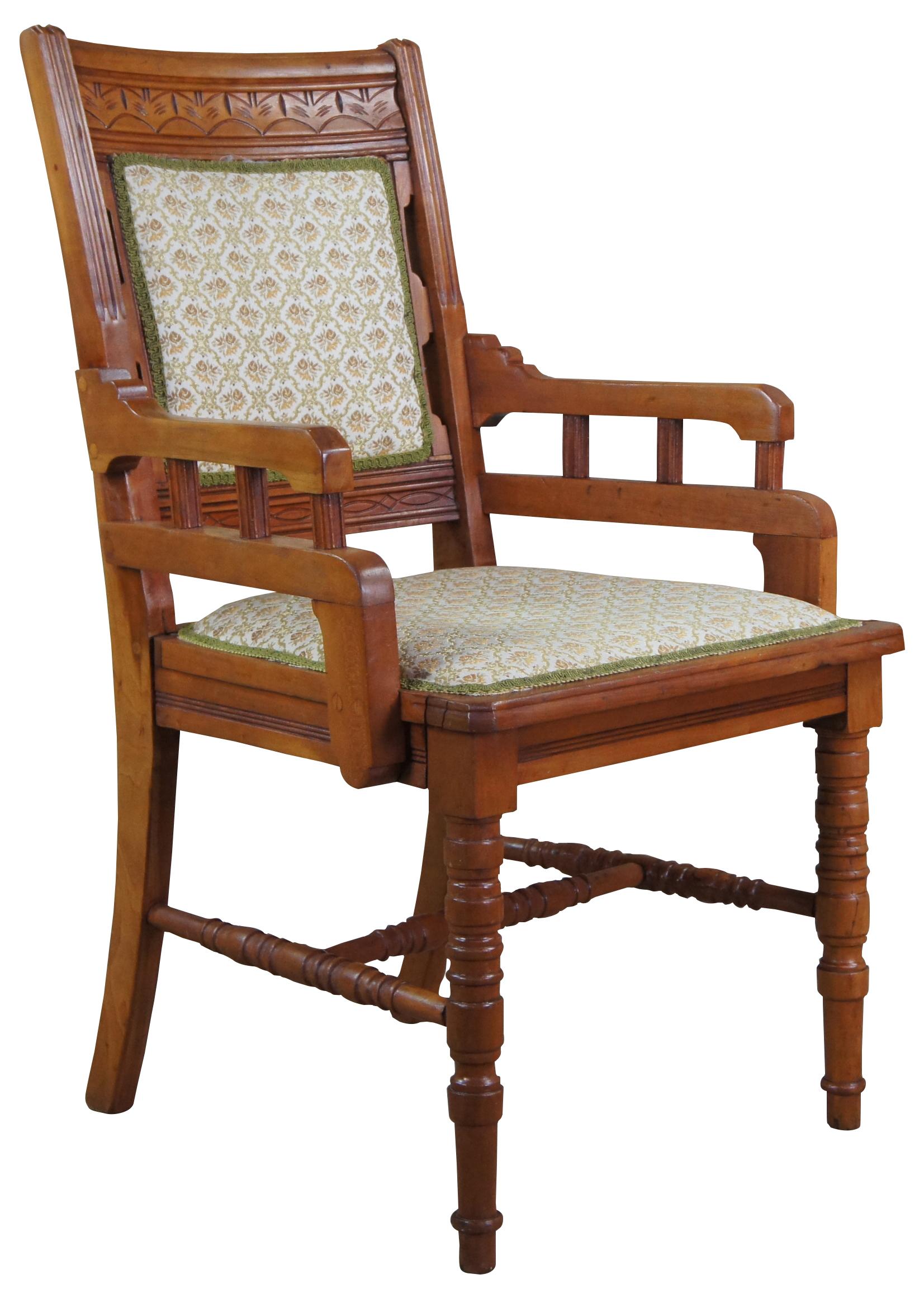 Antique 19th century Eastlake Victorian Aesthetic Movement (1870s-1890s) parlor armchair. Made of walnut featuring fluted and turned supports with upholstered seat and back.
  