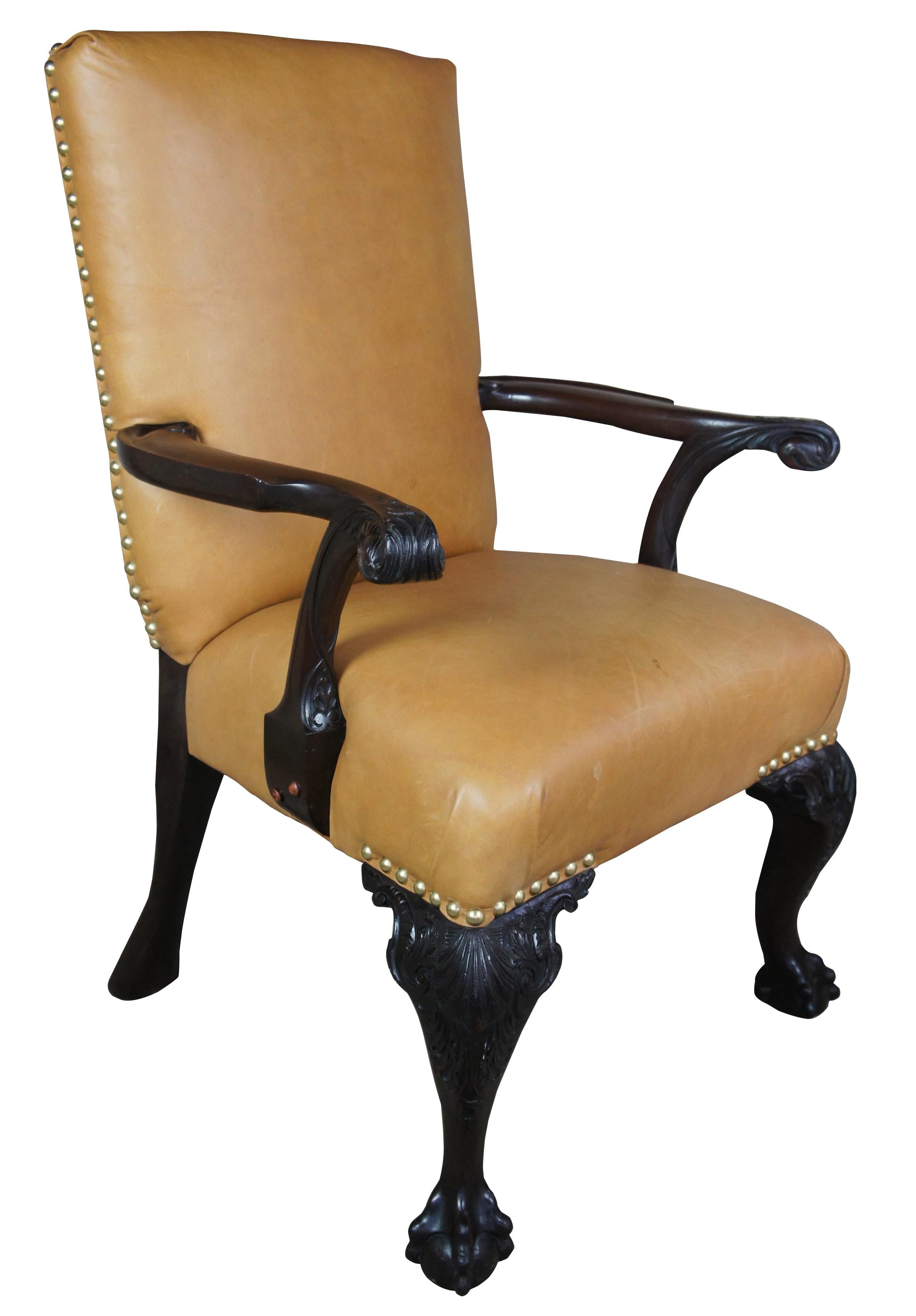 English Chippendale style armchair carved mahogany leather ball claw

A beautiful heavy English Chippendale style arm chair. Made from mahogany with tan leather and nailhead trim. Heavily carved with cabriole legs and ball and claw feet. Great for