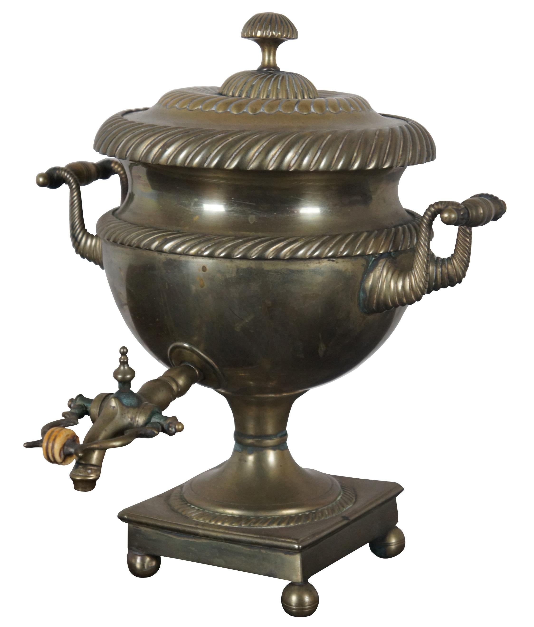 Antique brass samovar shaped like a neoclassical urn. Regency era, circa 1800s. Features ornate gadrooning and turned handles.
     