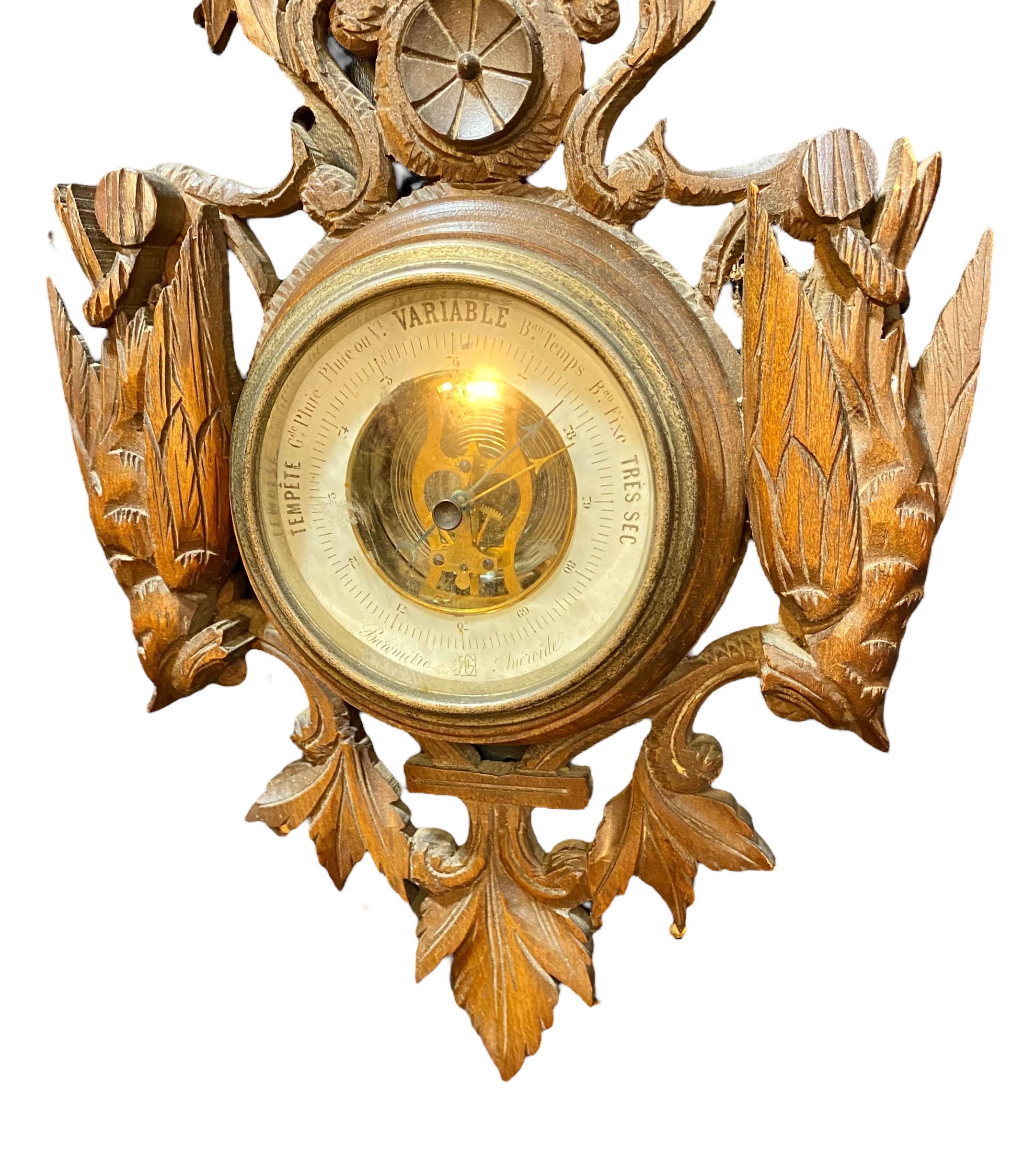 An antique French Black Forest walnut aneroid barometer having the original thermometer, hand carved game birds, hunting dog, leaves and scrolls.
A lovely piece to display in a grouping or simply alone in your study, living room, dining room,