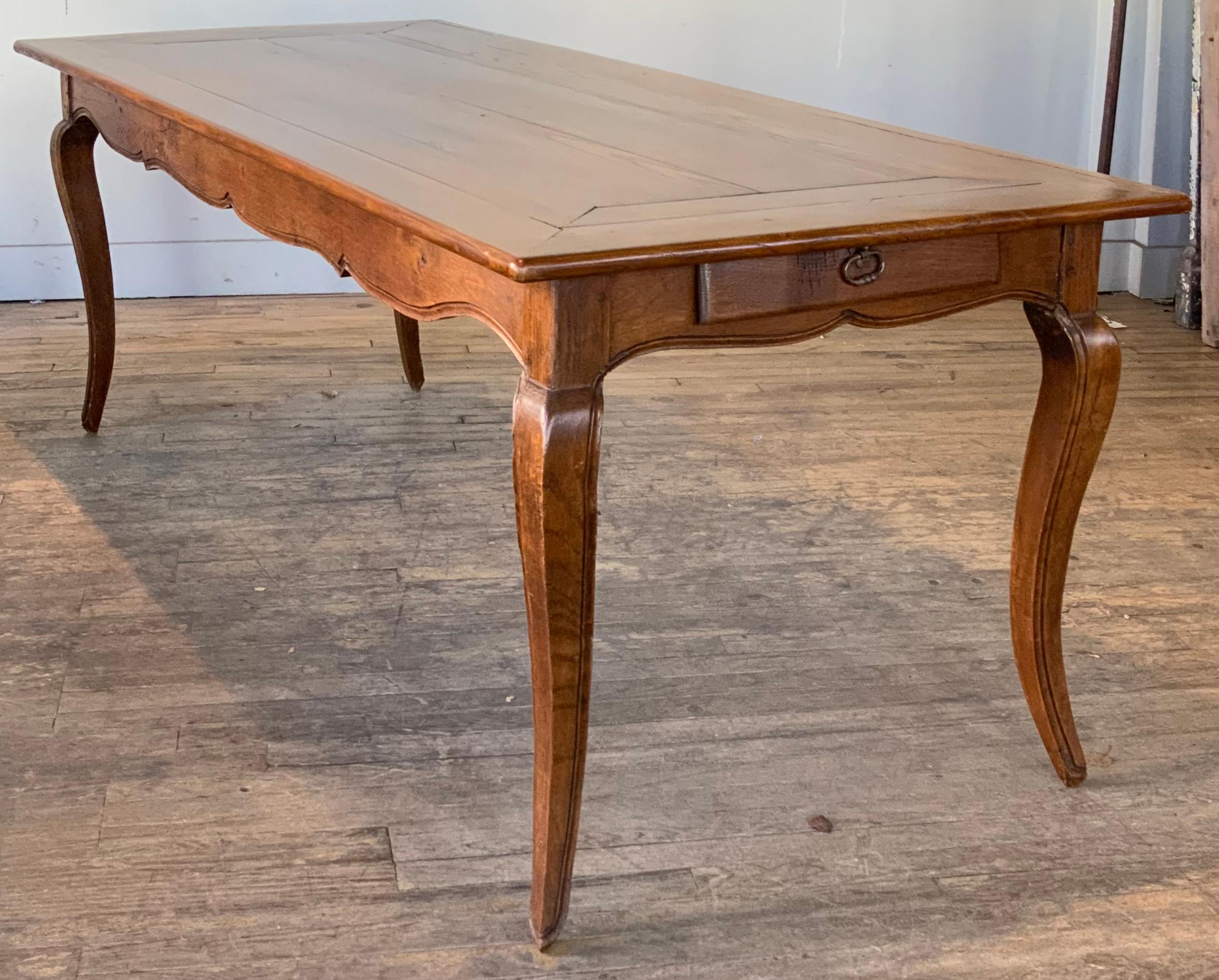 a wonderful antique 19th century French Country chestnut dining table, with a single drawer at one end. beautiful wood and lovely curved legs. this table was professionally restored with a true french polish finish. 