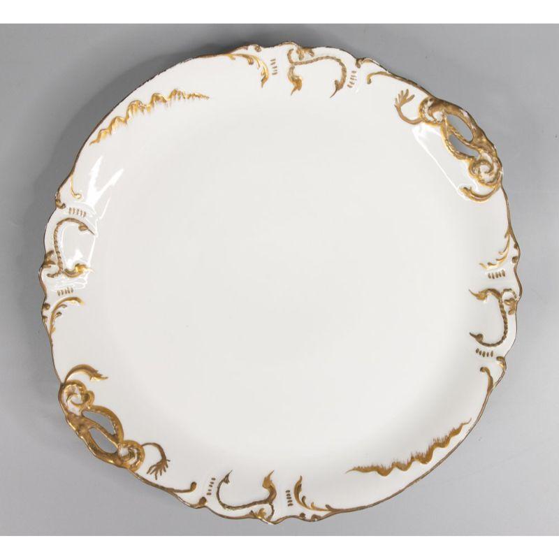 A gorgeous antique French Limoges porcelain serving platter with lovely gilt details made in France, circa 1890. Maker's mark on reverse. This beautiful platter is a nice large size and stunning details and would be fabulous for display or serving