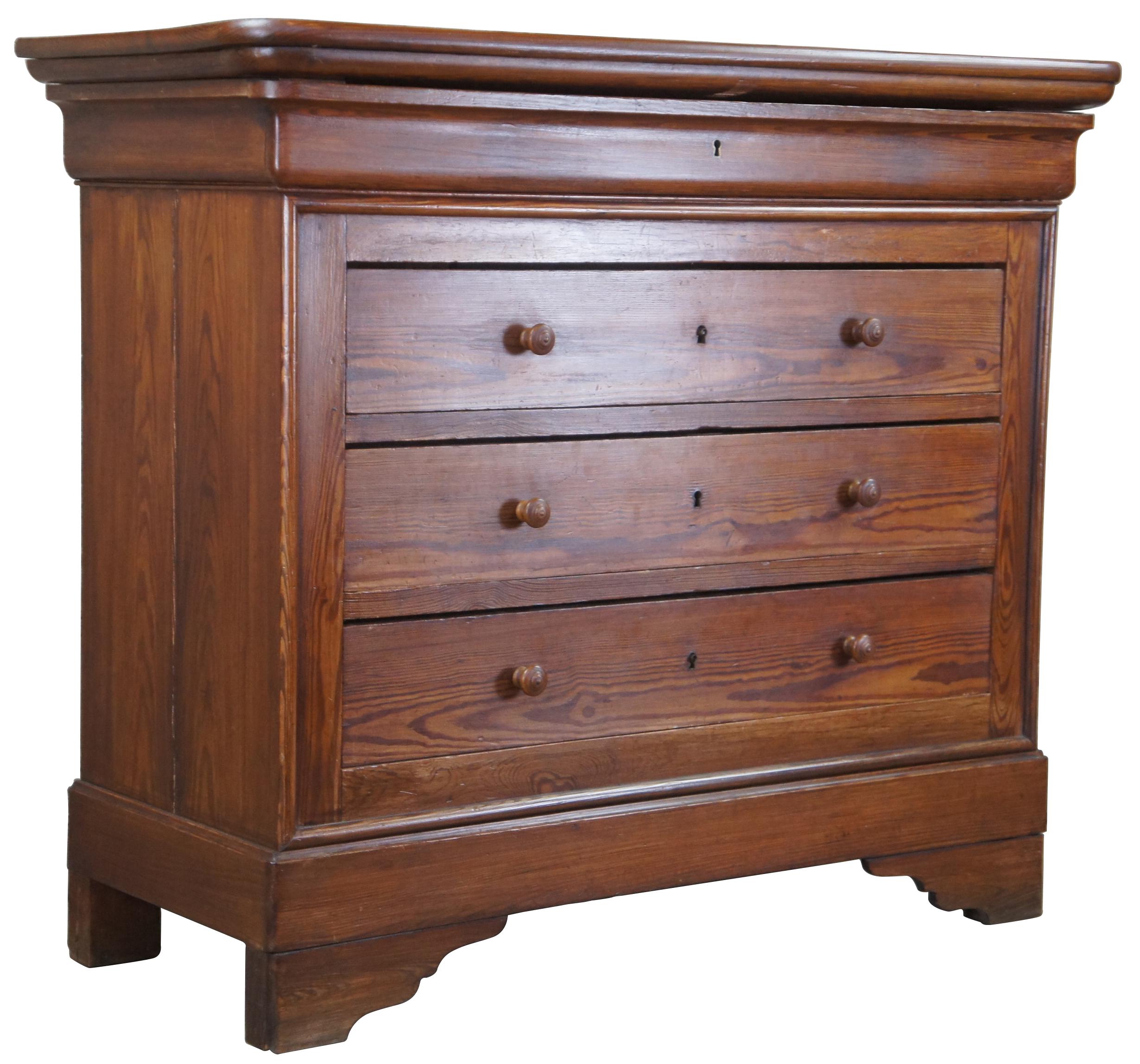 Late 19th century Louis Philippe commode. A rectangular form crafted from pine with three drawers in addition to an upper cornice drawer. 
 
