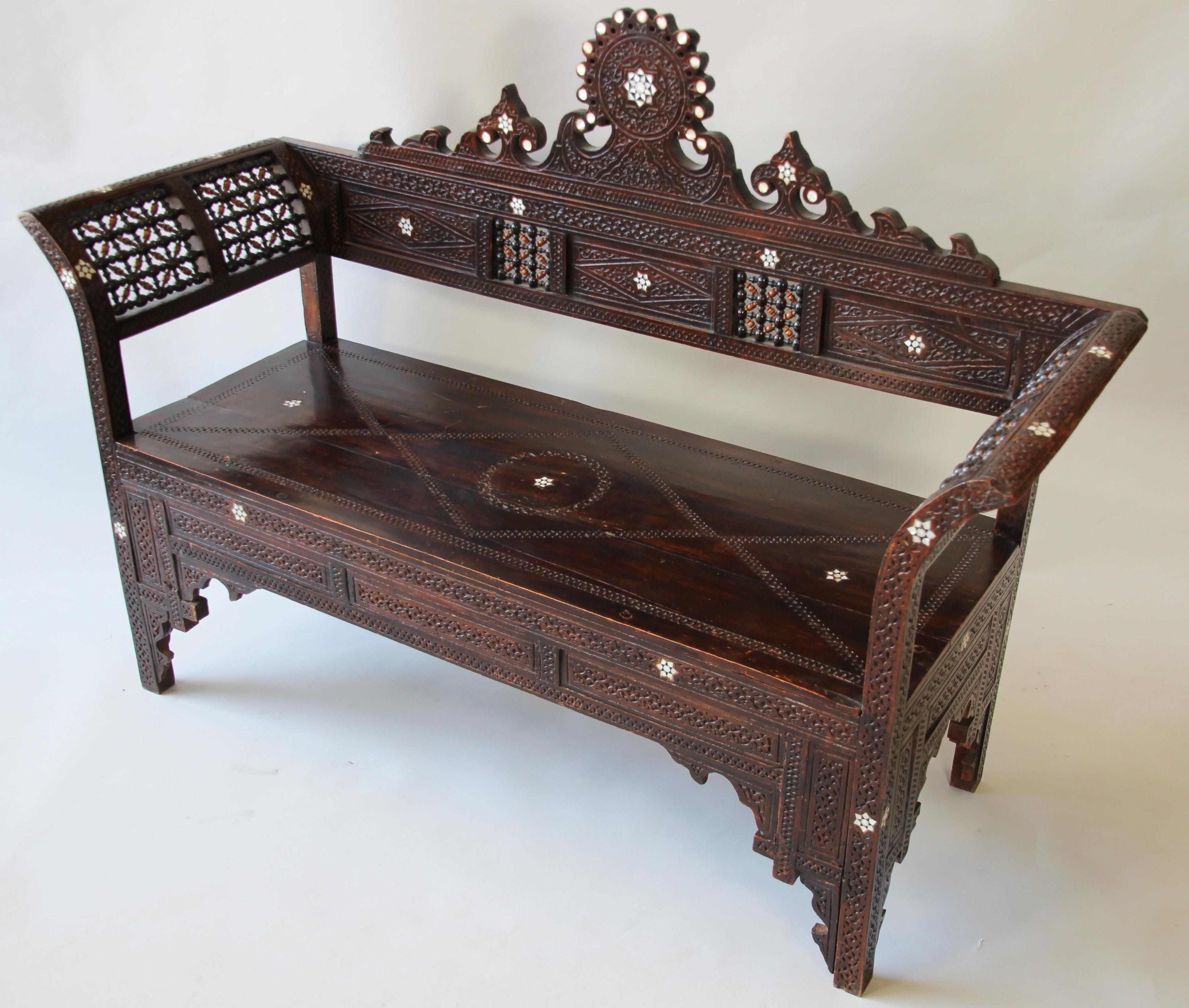 Antique 19th century Syrian Moorish Middle Eastern Arabian finely hand carved and inlaid with mother of pearl.
Nice moucharabie designs all-over the chair.
Syrian Damascene hand carved walnut wood inlaid with mother of pearl stars designs, hand