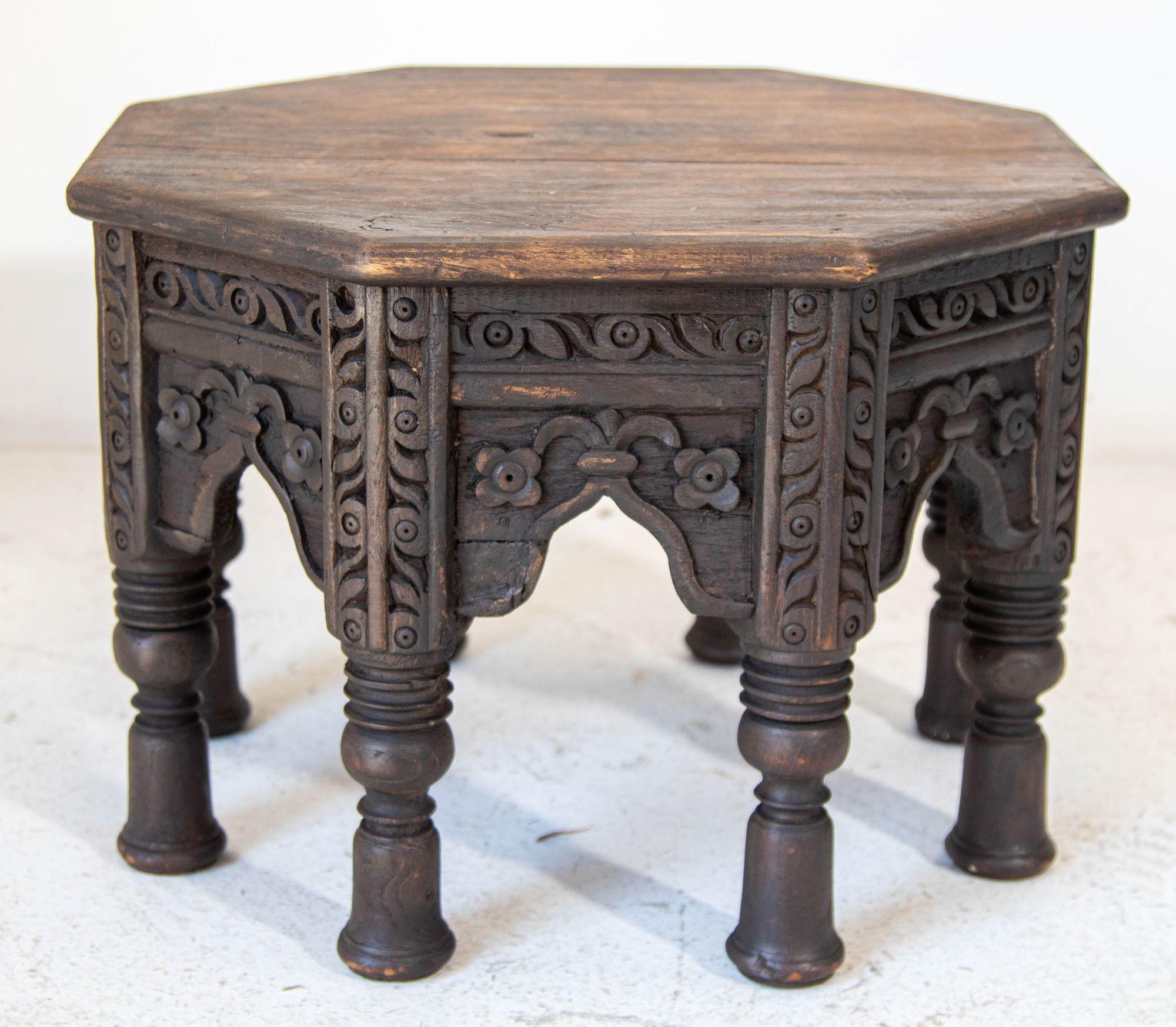 Antique 19th c. Octagonal Moorish Side Table Hand-carved with geometric design.
Beautiful octagonal, ebonized rustic wood low side table with an intricately carved pattern on the sides.
Moorish style side table made of richly patinated oak with